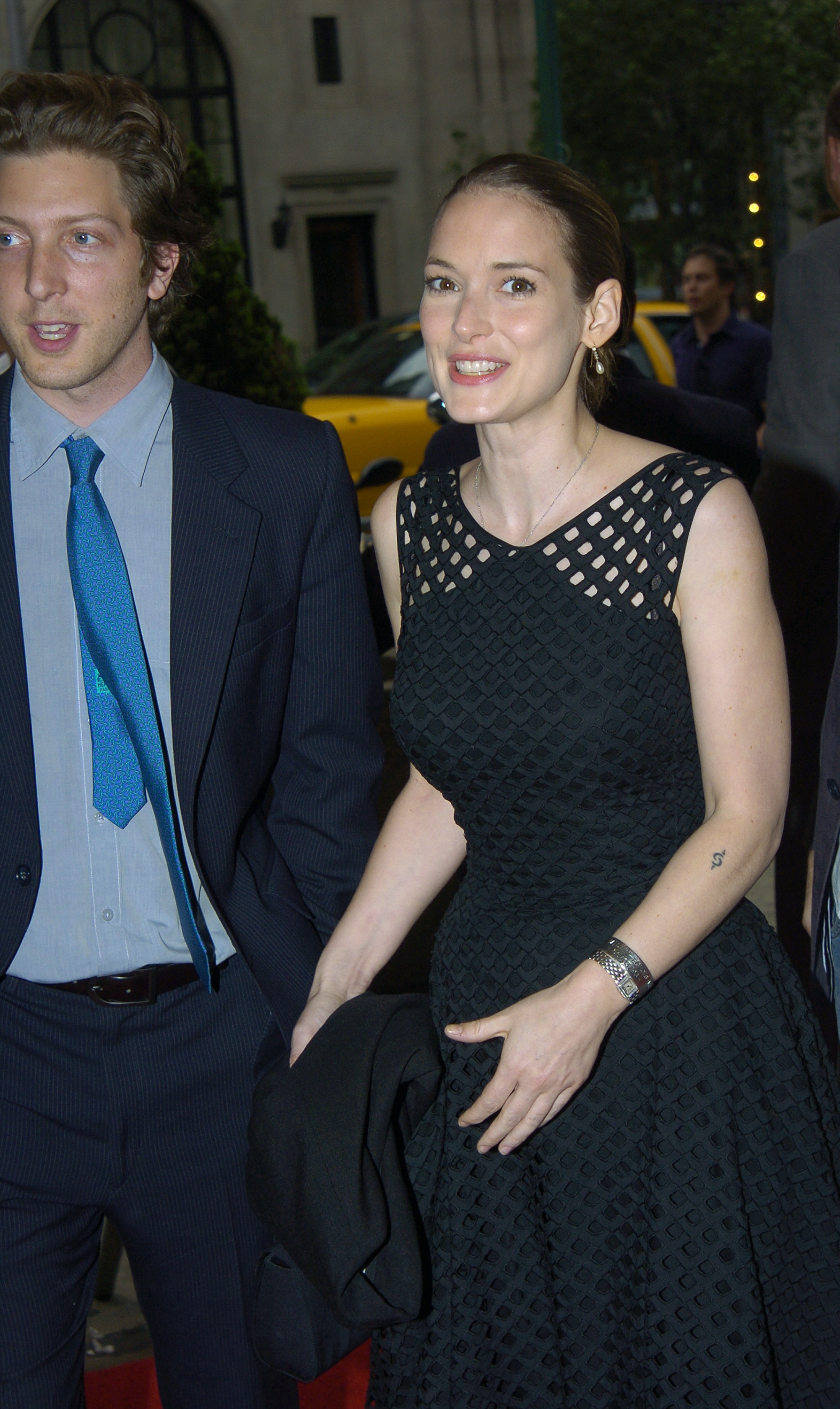 Winona Ryder and an unidentified man at the "Murderball" premiere in New York City, 2005 | Source: Getty Images