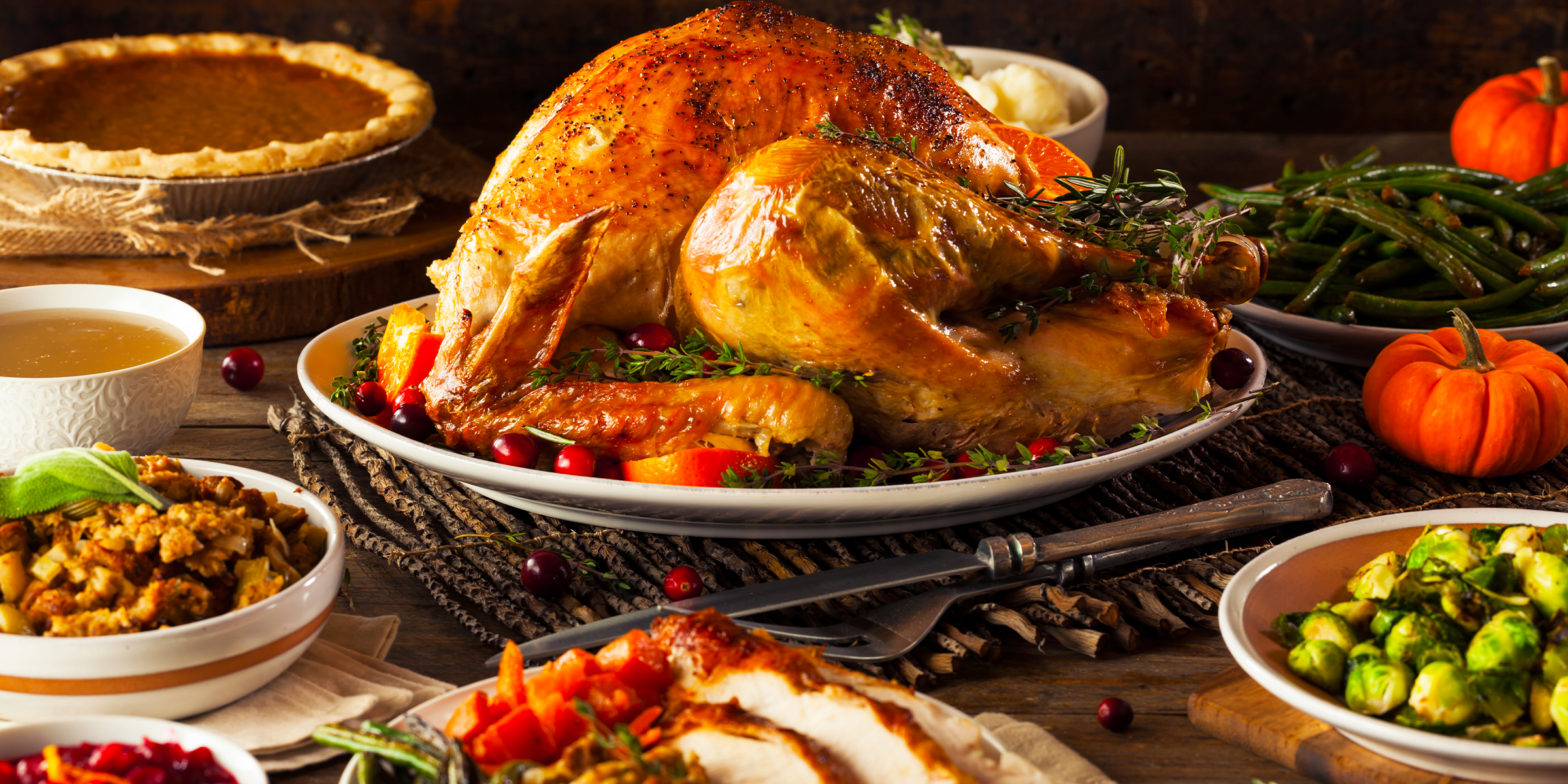 Homemade roasted Thanksgiving turkey with side dishes | Source: Shutterstock