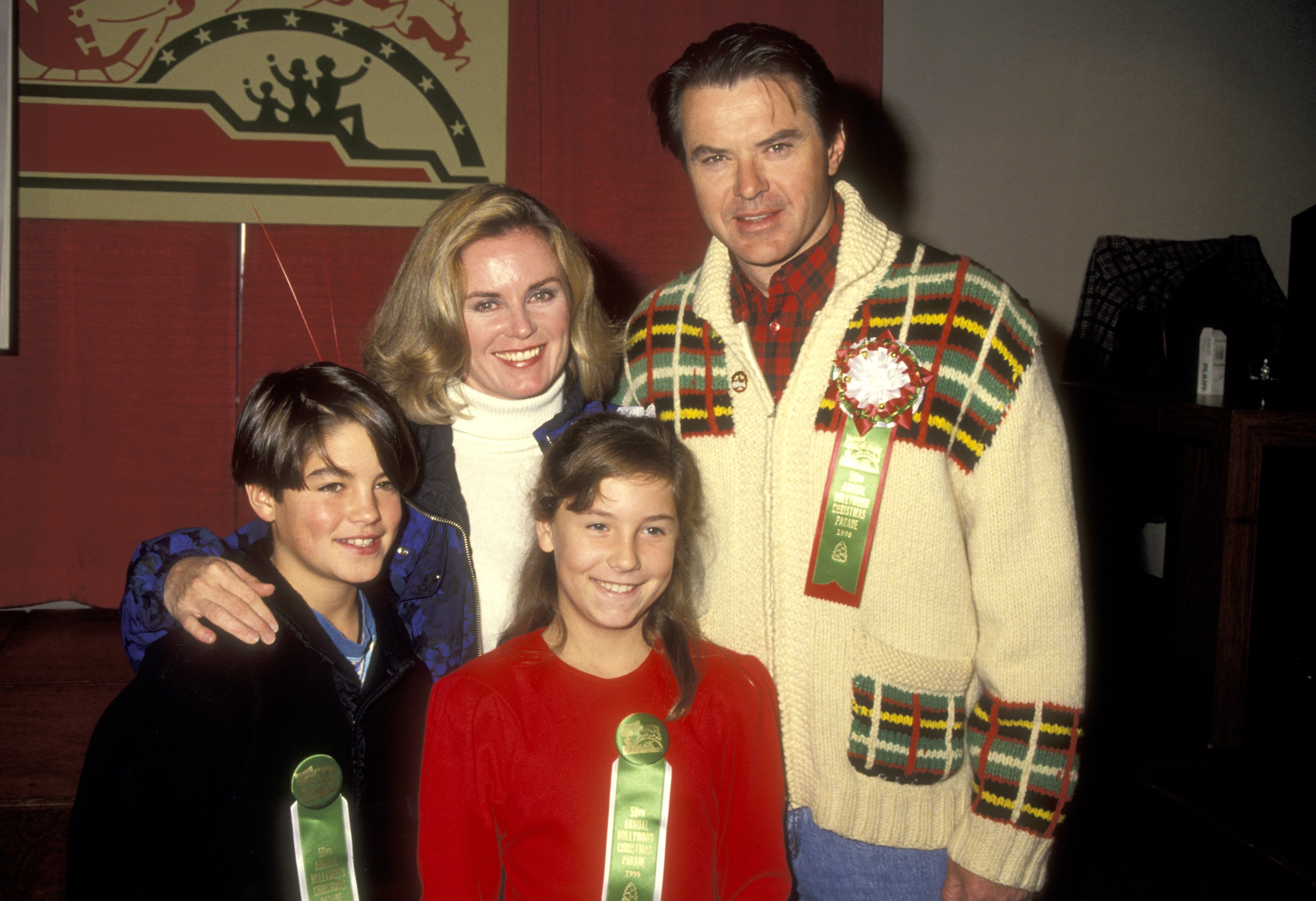 Robert Urich, wife Heather Menzies, son Ryan Urich ,and daughter Emily Urich at the 59th Annual Hollywood Christmas Parade 1990, Hollywood, California. | Source: Getty Images