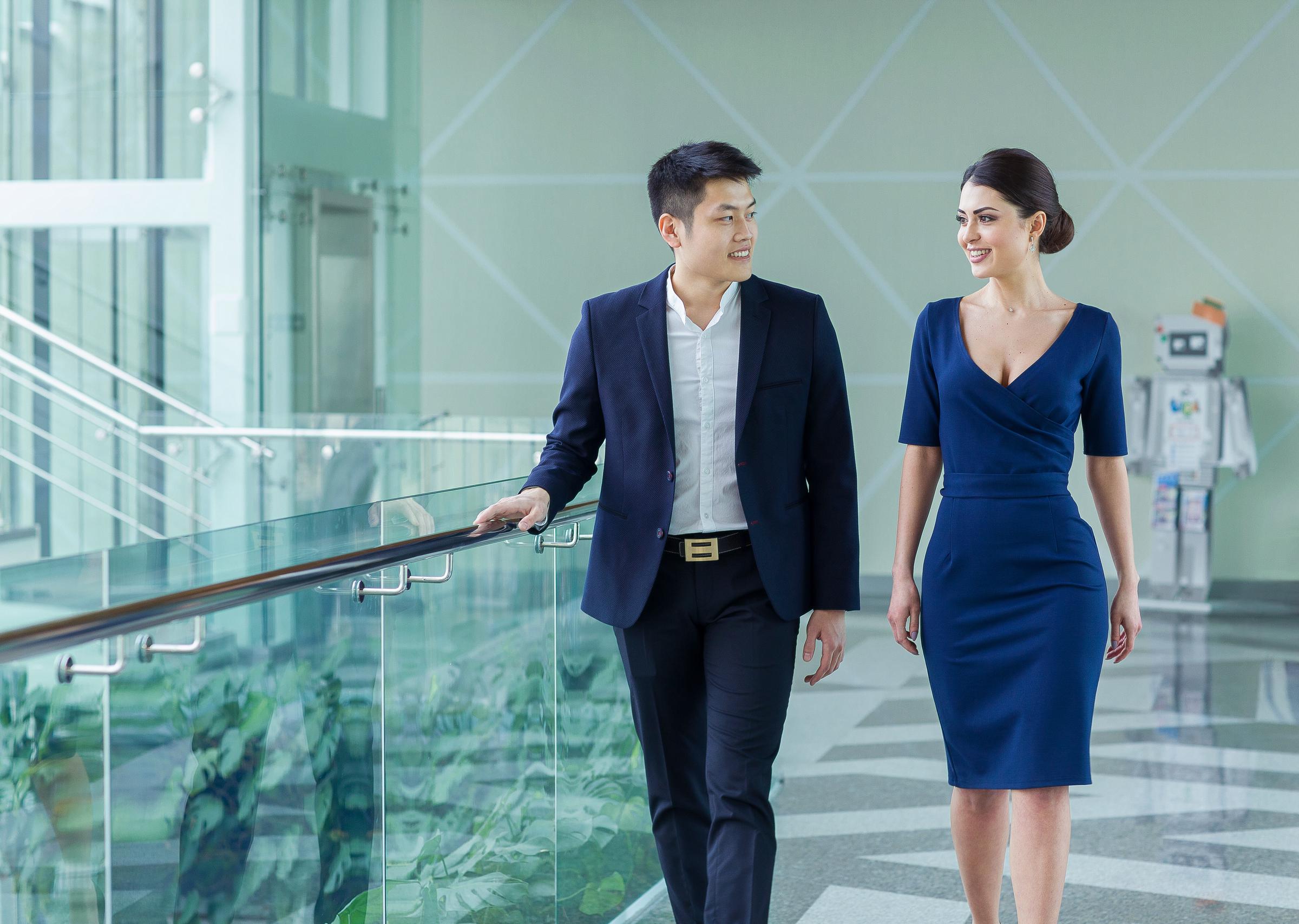 Man and a woman walking while talking | Source: Shutterstock