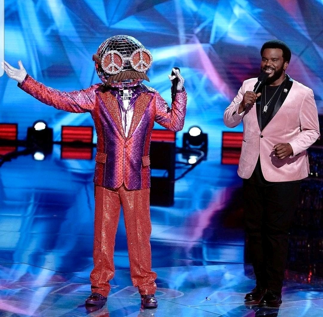 "The Masked Dancer" presenter, Craig Robinson with former contestant, Ice T in the mask in December, 2020. | Photo: Getty Images
