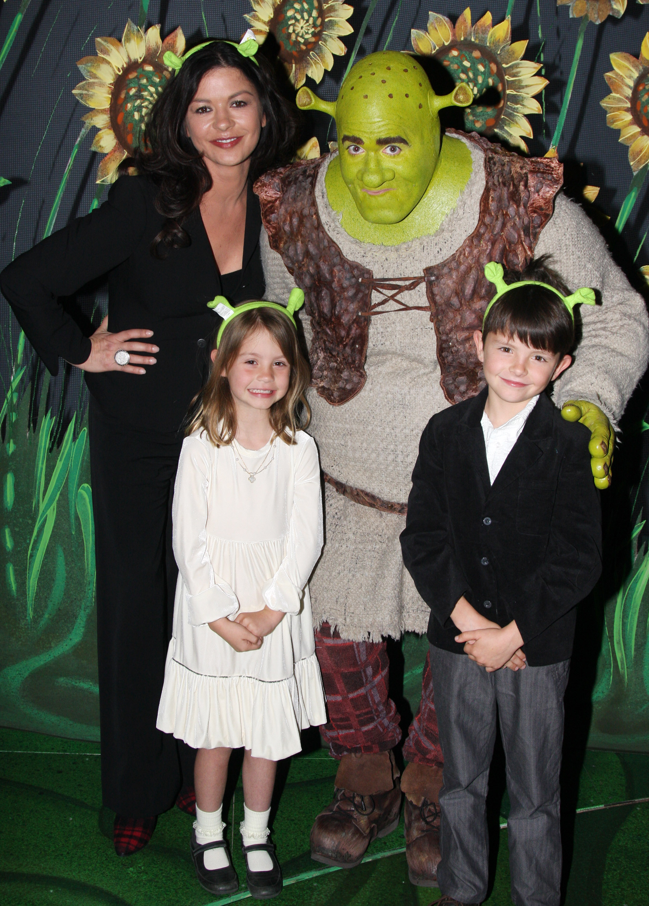 Catherine Zeta-Jones, Brian d'Arcy James as "Shrek", Carys Douglas and Dylan Douglas posing backstage of "Shrek:The Musical" at the Broadway Theatre on March 21, 2009 in New York City | Source: Getty Images