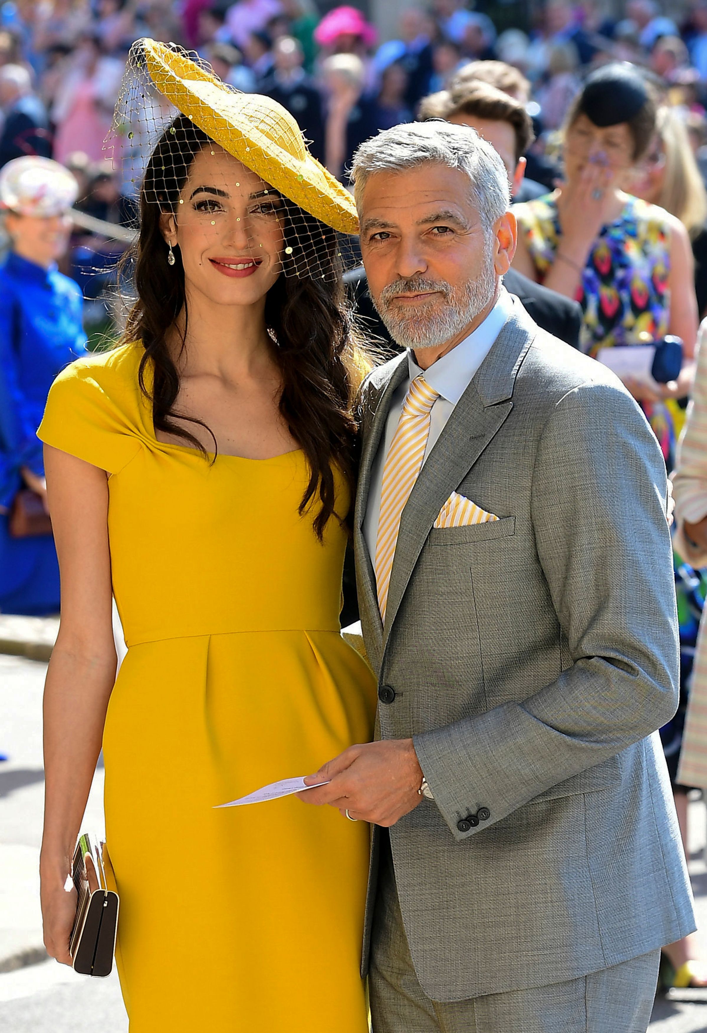 George Clooney and Amal Clooney arrive for the wedding ceremony of Britain's Prince Harry, Duke of Sussex and US actress Meghan Markle at St George's Chapel, Windsor Castle, in Windsor, on May 19, 2018. | Source: Getty Images