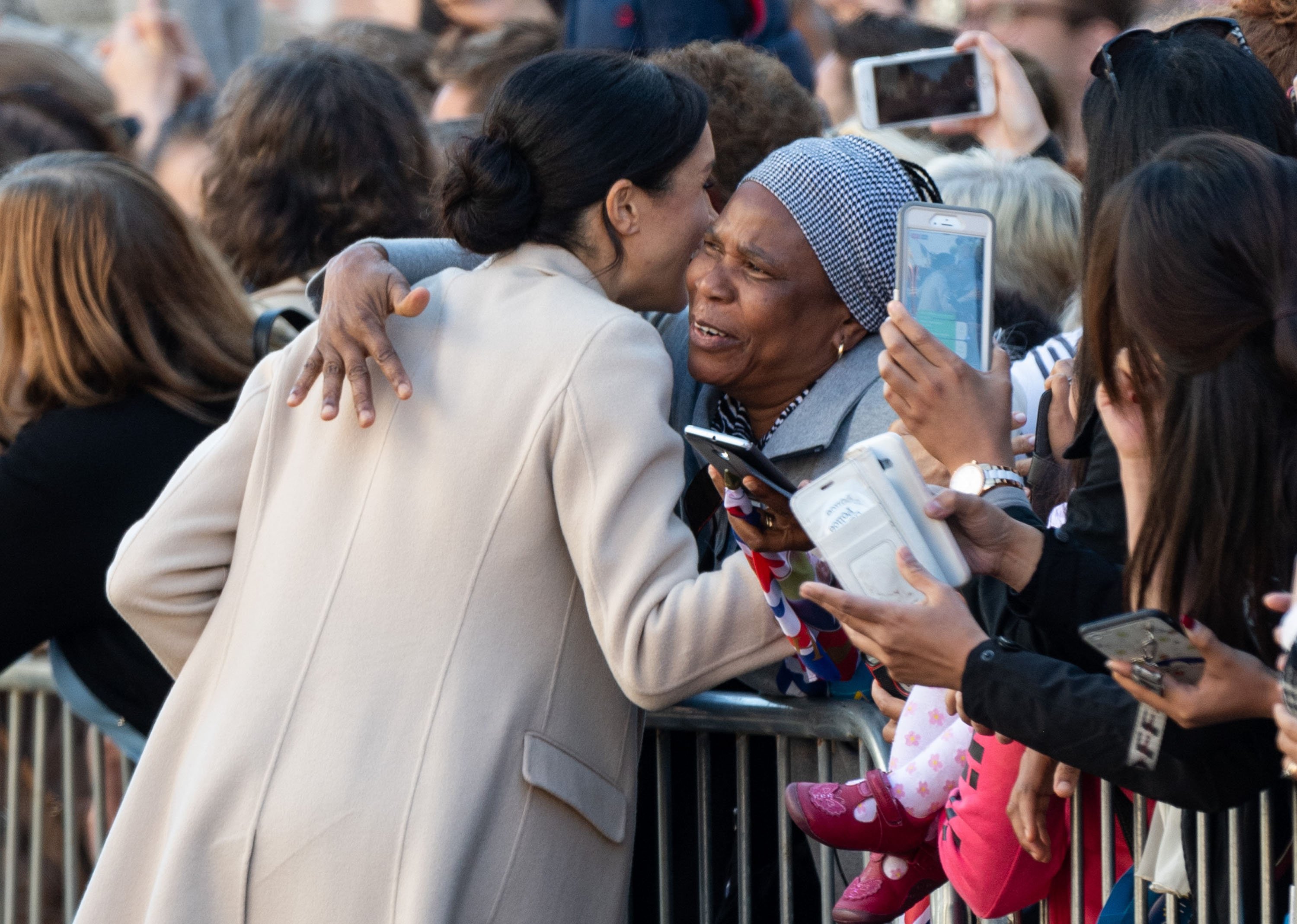 Meghan, Duchess of Sussex gets a hug from a member of the public during a visit to Edes House during an official visit to Sussex on October 3, 2018 | Source: Getty Images