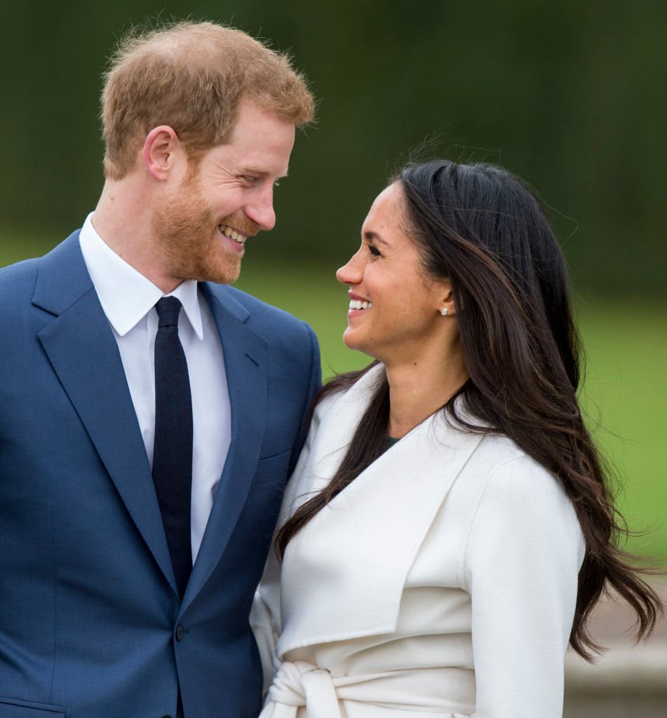 Prince Harry and actress Meghan Markle during an official photocall to announce their engagement at The Sunken Gardens at Kensington Palace on November 27, 2017 in London, England. | Source: Getty Images