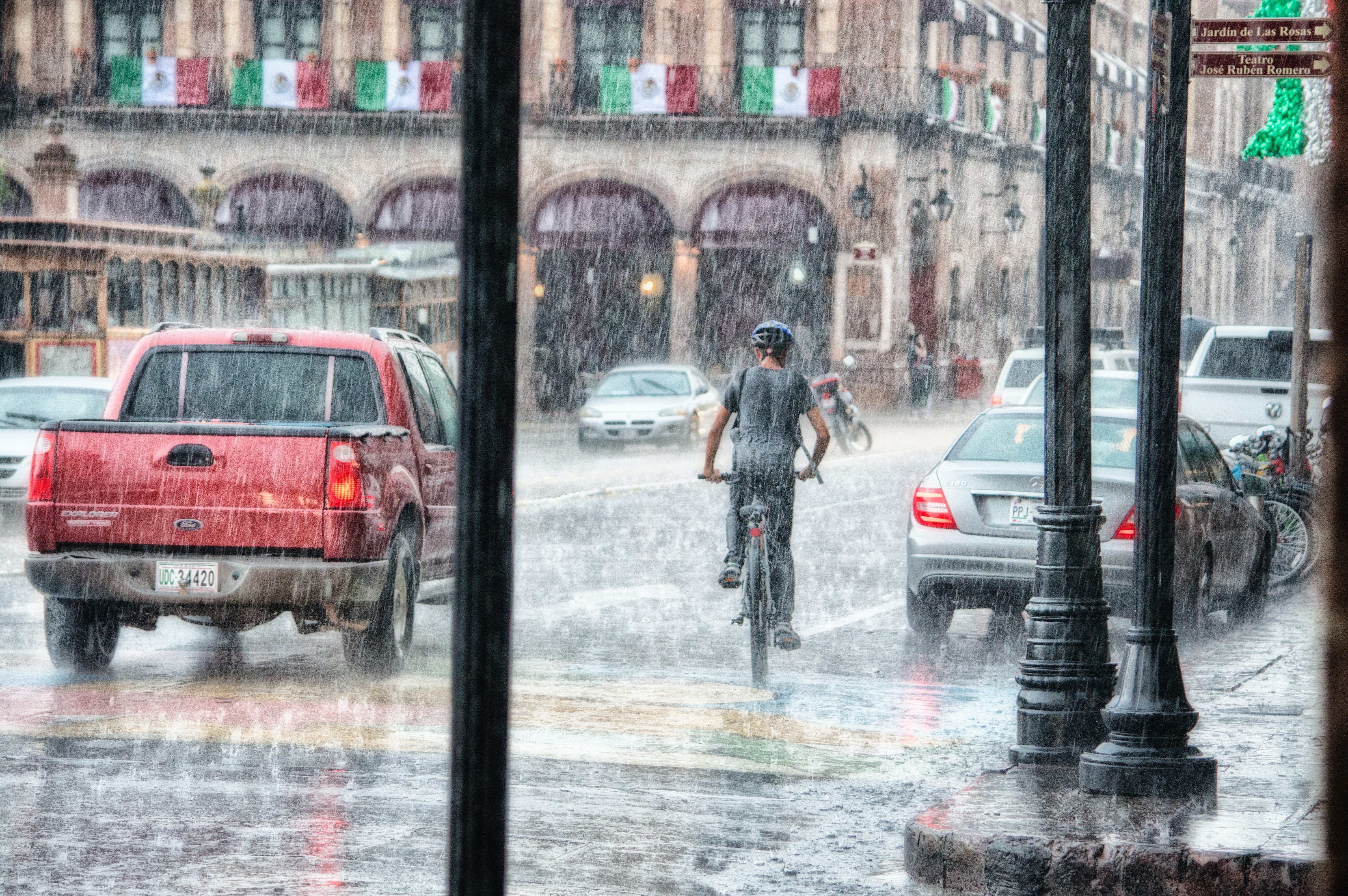 Pictured - An individual riding a bicycle during a rainy day | Source: Pexels 