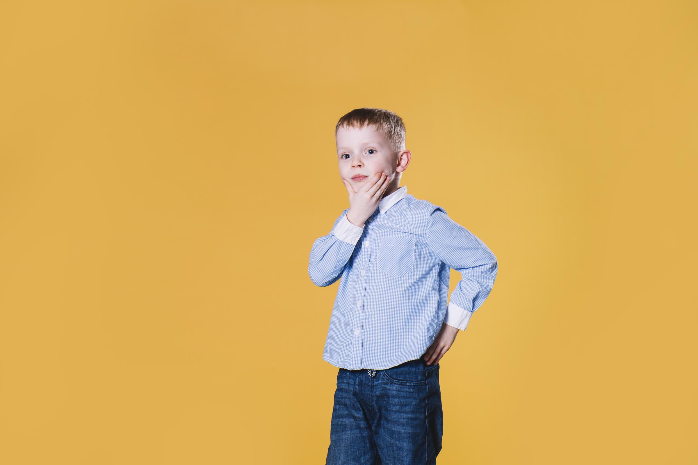 A thoughtful little boy | Source: Freepik