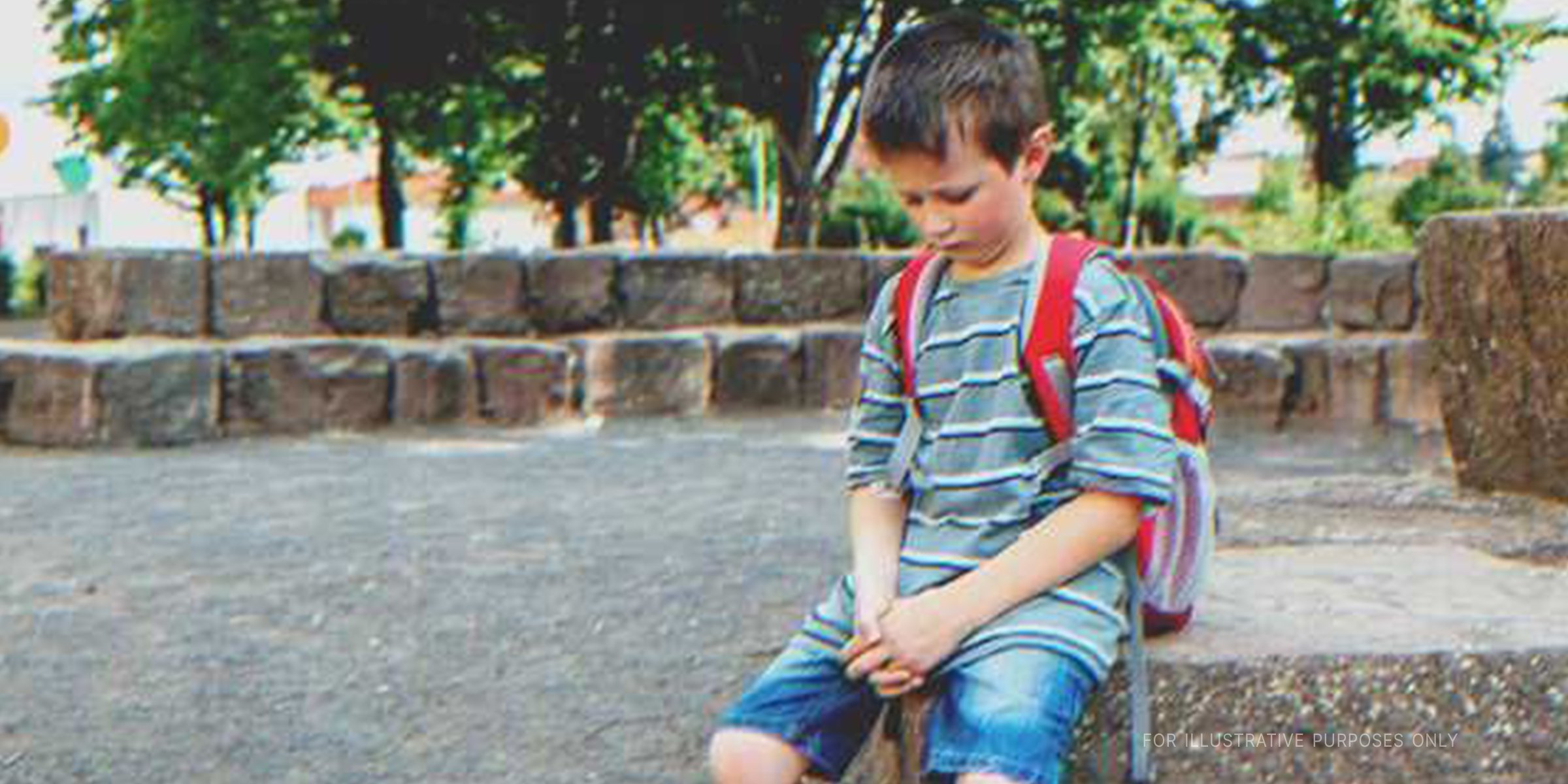 Sad boy in the school yard | Shuttertock.com