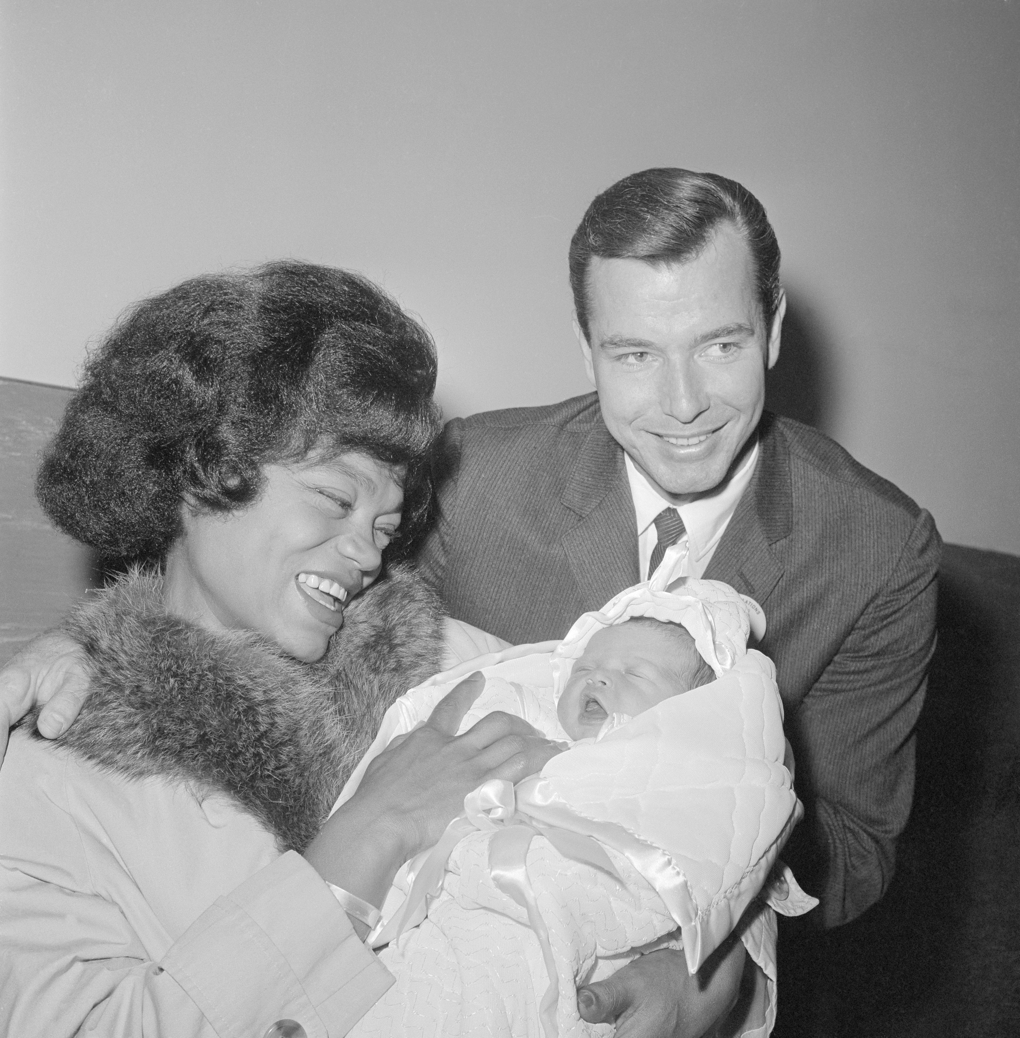 Eartha Kitt and her husband William McDonald are all smiles as they debut their 4 day old baby girl named Kitt, whom they welcomed on November 27, 1961 at Cedars of Lebanon Hospital | Photo; Getty Images