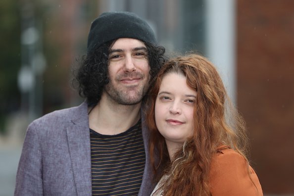 Two young couples posing for a photo | Photo: Getty Images