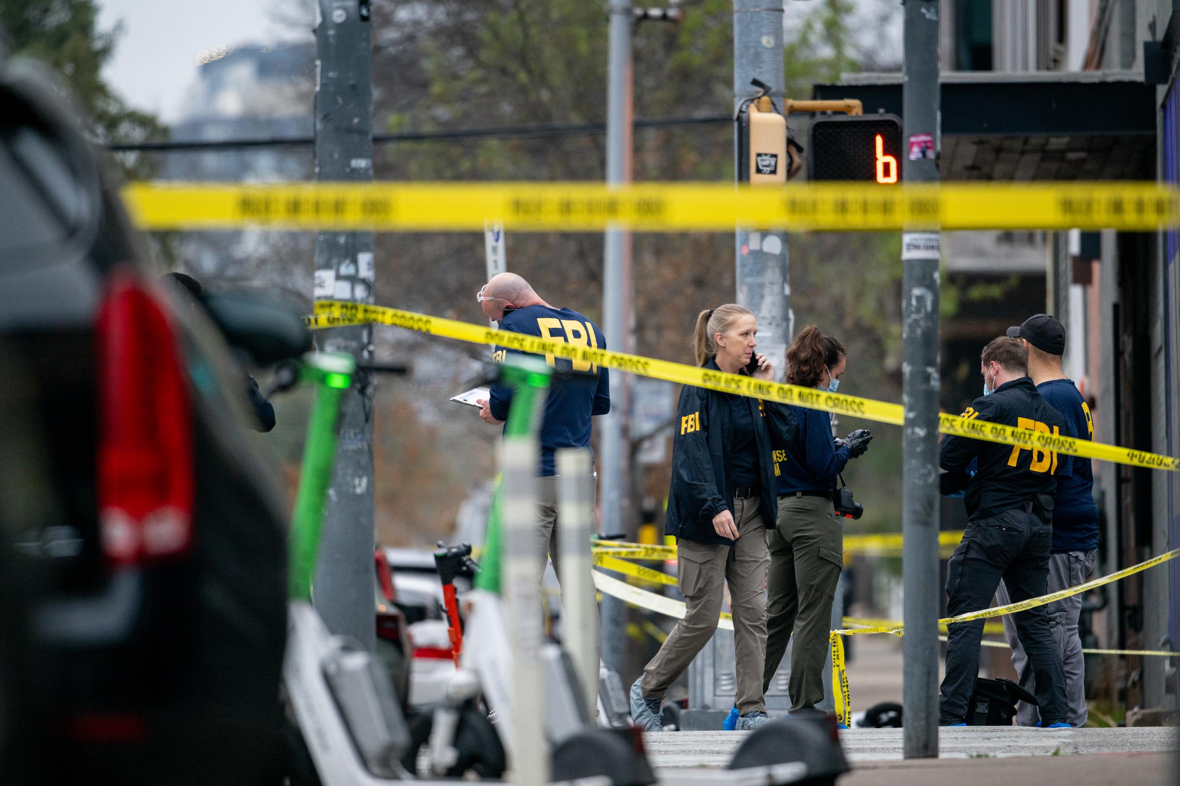 FBI agents investigate near Buford's bar in downtown Austin on March 1, 2026, following the mass shooting. | Source: Getty Images
