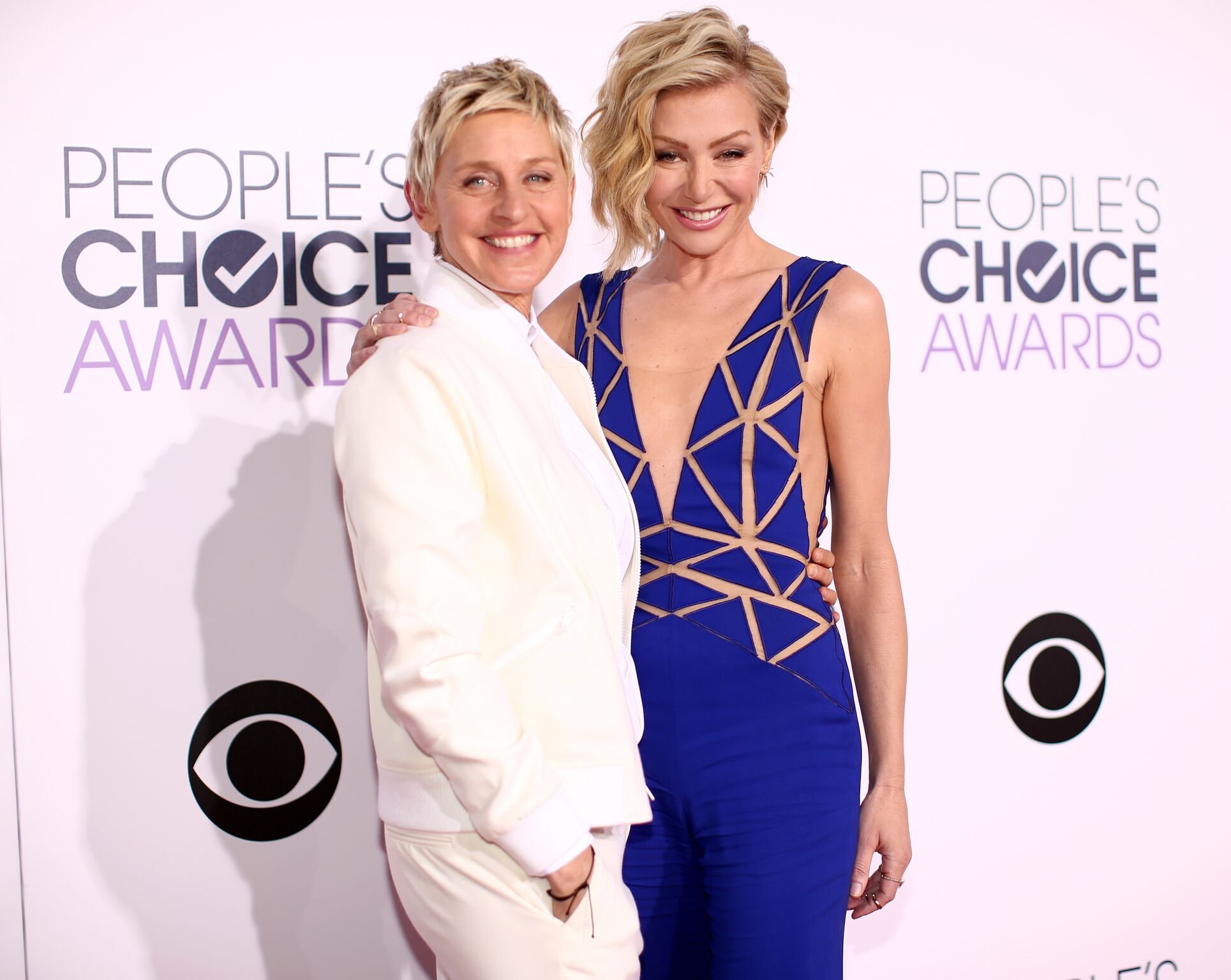 Ellen DeGeneres (L) and actress Portia de Rossi attend The 41st Annual People's Choice Awards at Nokia Theatre LA Live | Getty Images