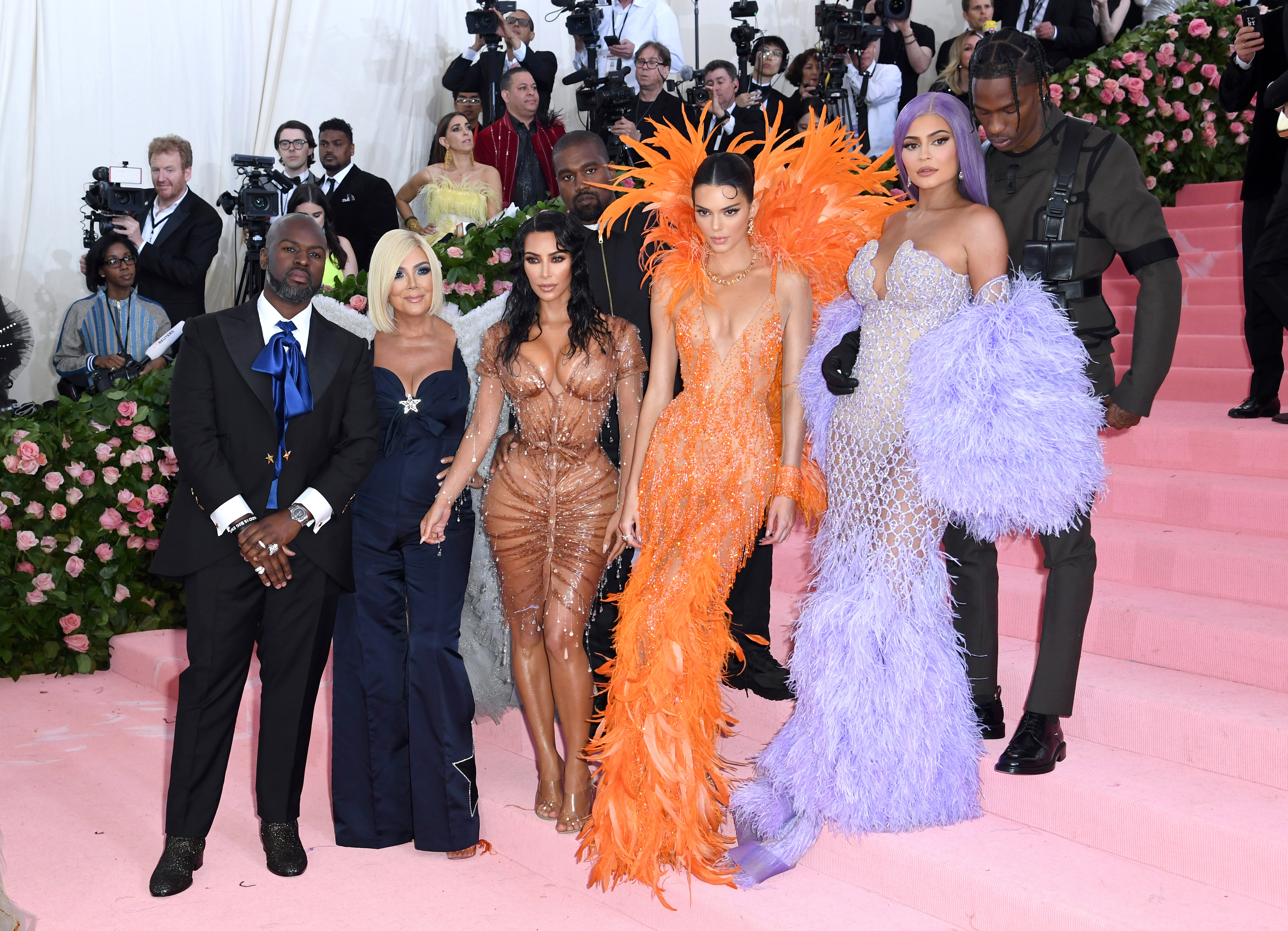 Kris Jenner and her daughters Kim Kardashian-West, Kendall, and Kylie Jenner took their fashion game up a notch as they posed with Corey Gamble, Kanye West, and Travis Scott at the Met Gala celebrating "Camp: Notes on Fashion" on May 6, 2019, in New York City.