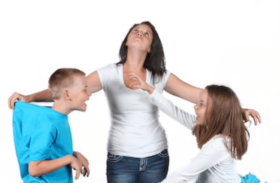 Mother stands in between her children to try stop her son and daughter from fighting | Source: Shutterstock