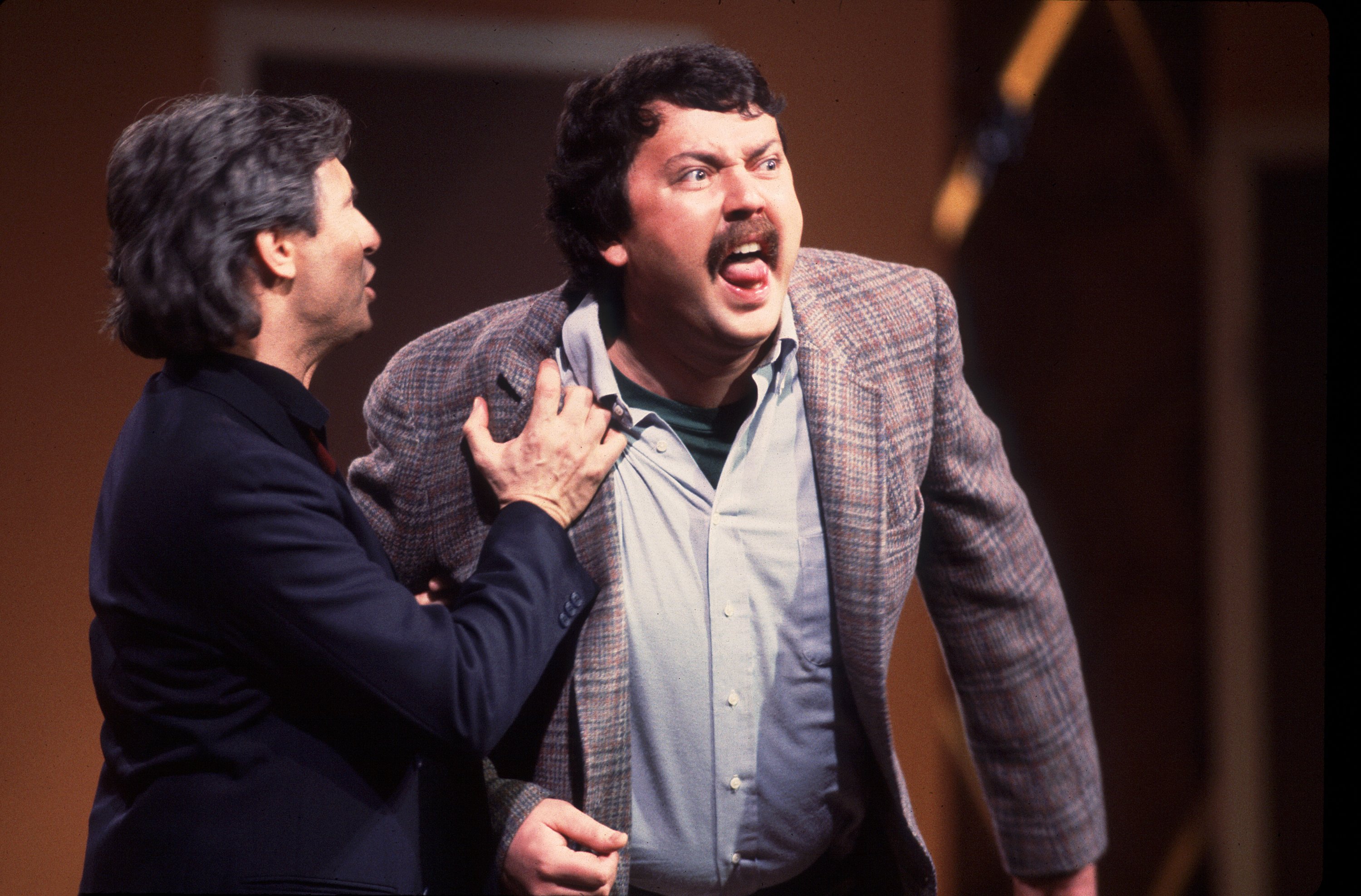 Canadian comedian David Steinberg and American comedian Mike Hagerty perform onstage during the Second City 25th Anniversary performance at the Vic Theater, Chicago, Illinois, December 16, 1984. | Source: Getty Images