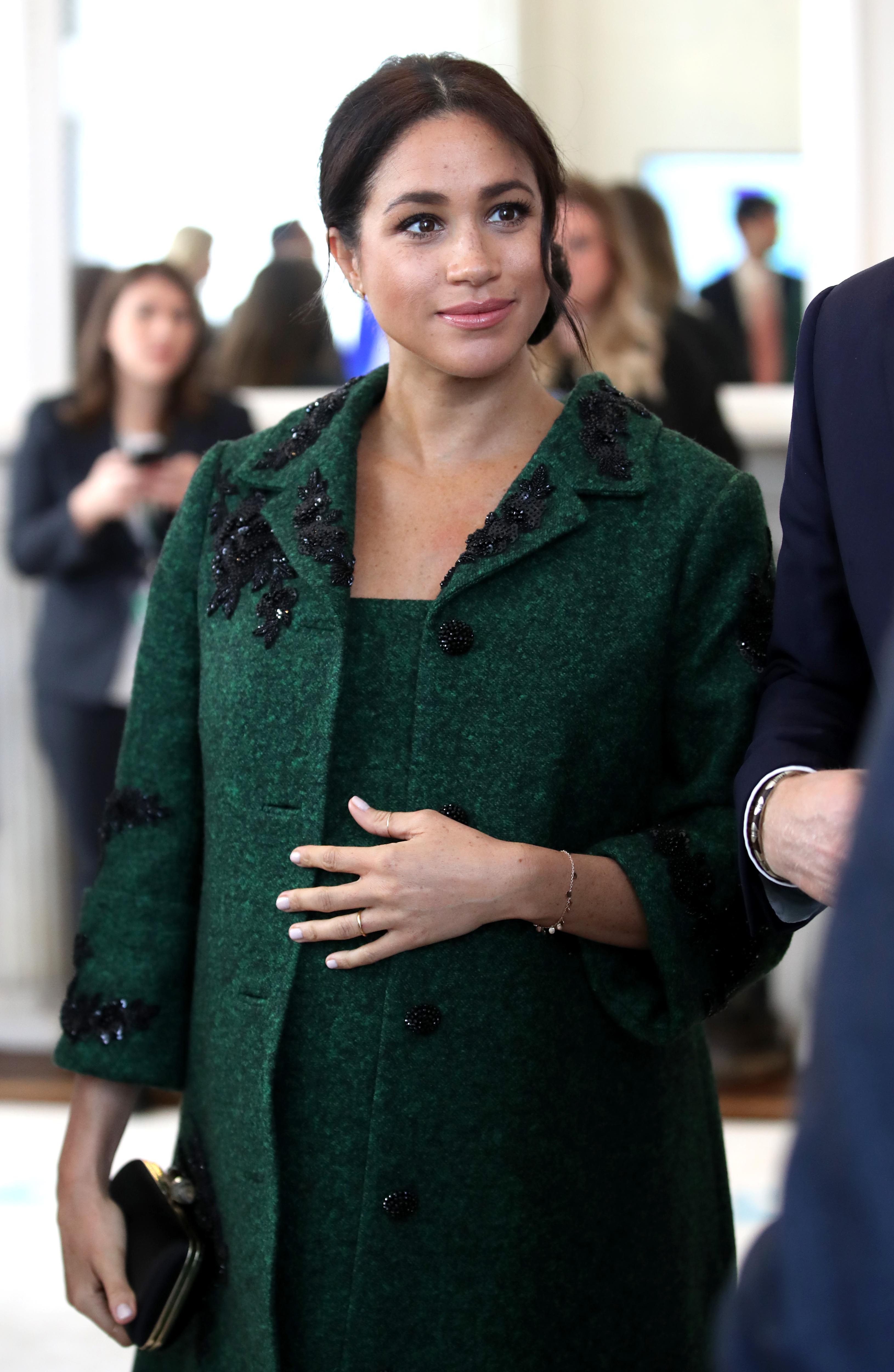 Meghan Markle cradling her baby bump on Commonwealth Day in March 2019 | Photo: Getty Images