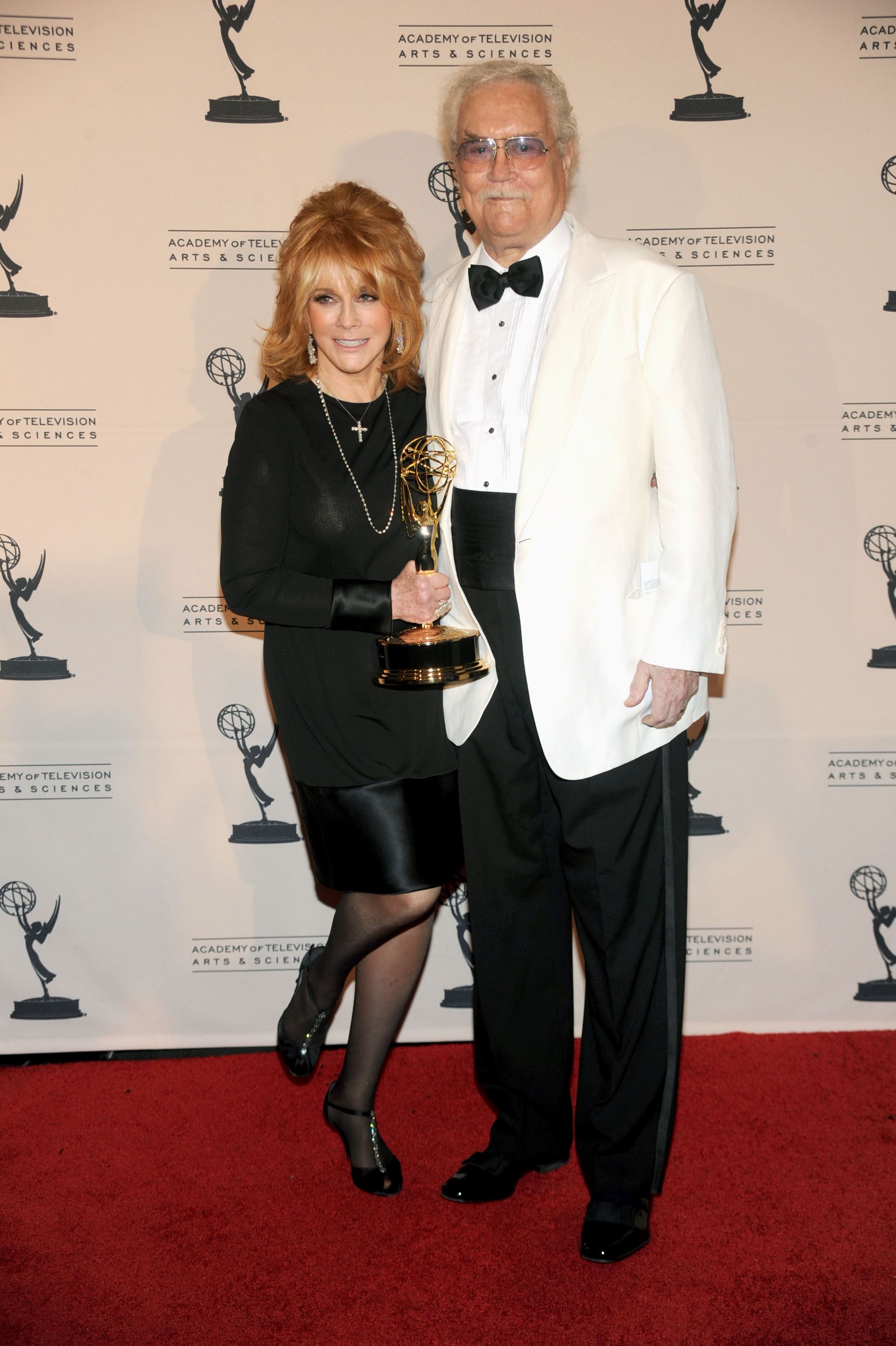 Actor Roger Smith (R) and actress Ann-Margret poses with Outstanding Guest Actress In A Drama Series award for "Law & Order: SVU" in press room during 62nd Primetime Creative Arts Emmy Awardsat the Nokia Theatre L.A. Live on August 21, 2010 in Los Angeles, California. | Source: Getty Images