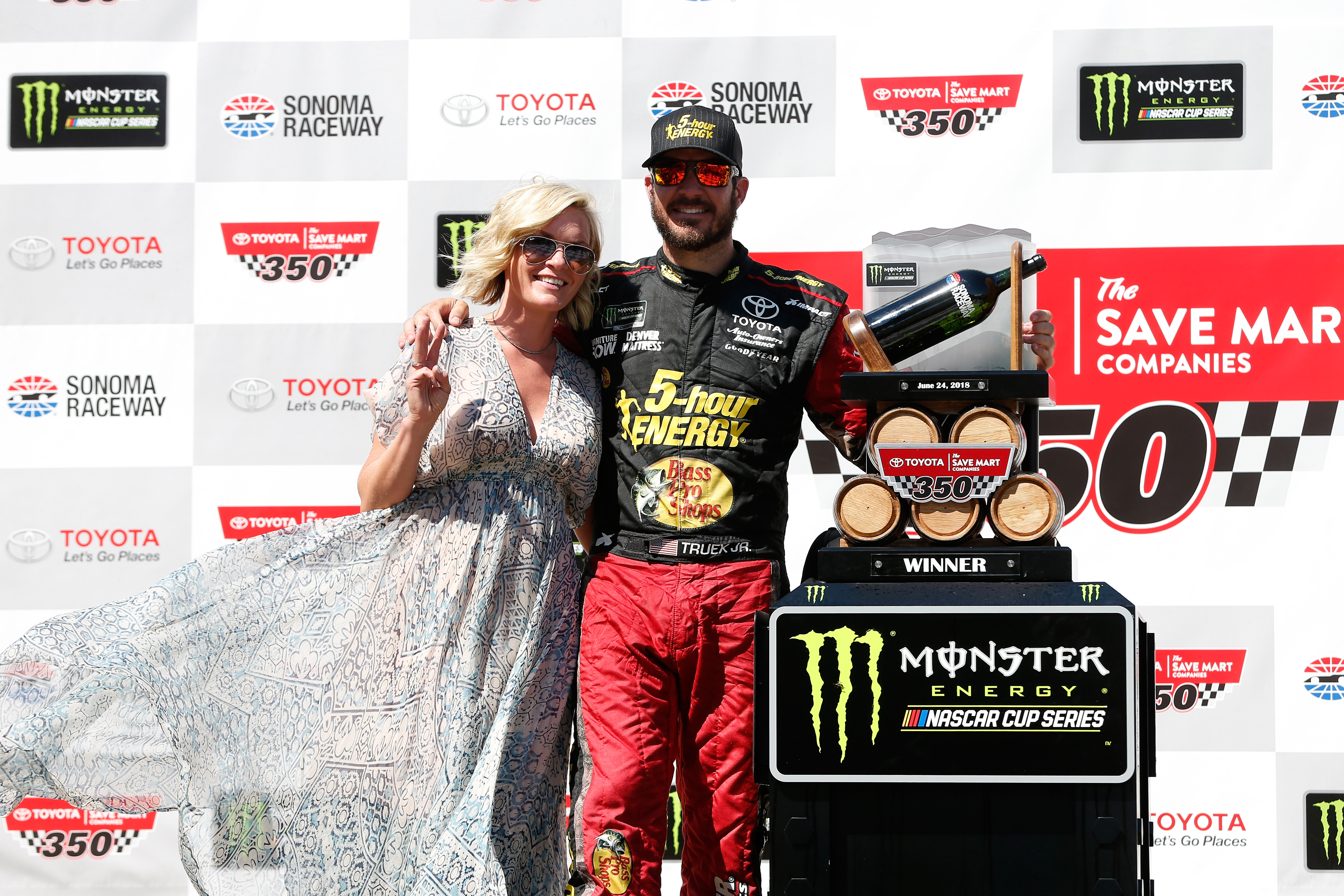 Sherry Pollex and Martin Lee Truex Jr. celebrates his victory after winning the Monster Energy NASCAR Cup Series Toyota/Save Mart 350 on June 24, 2018, in Sonoma | Source: Getty Images