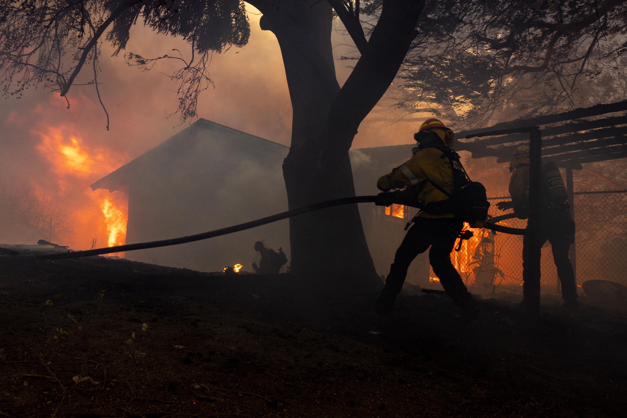 Firefighters attempting to control the blaze. | Source: Getty Images