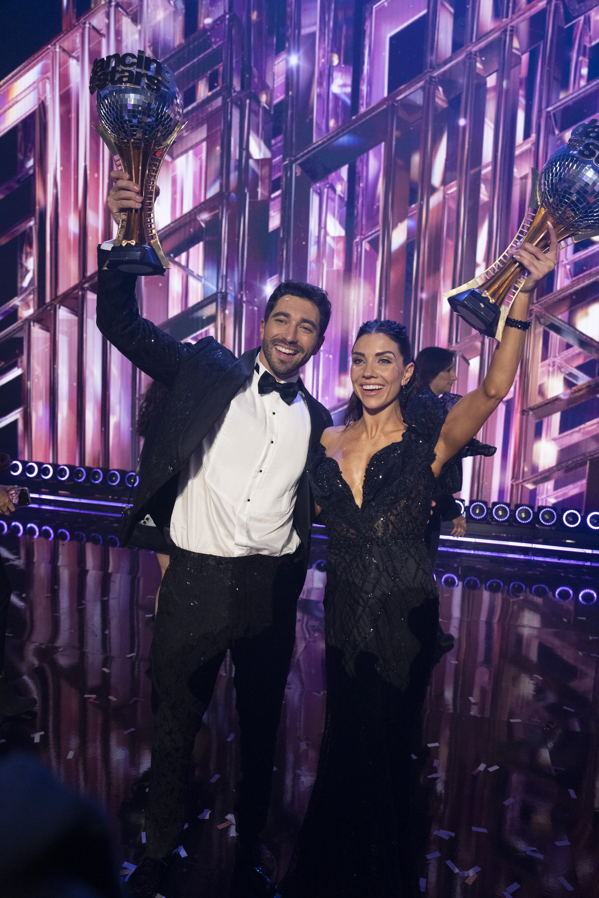 Joey Graziadei and Jenna Johnson hold their Mirrorball Trophy during "Dancing with the Stars" on November 26, 2024 | Source: Getty Images