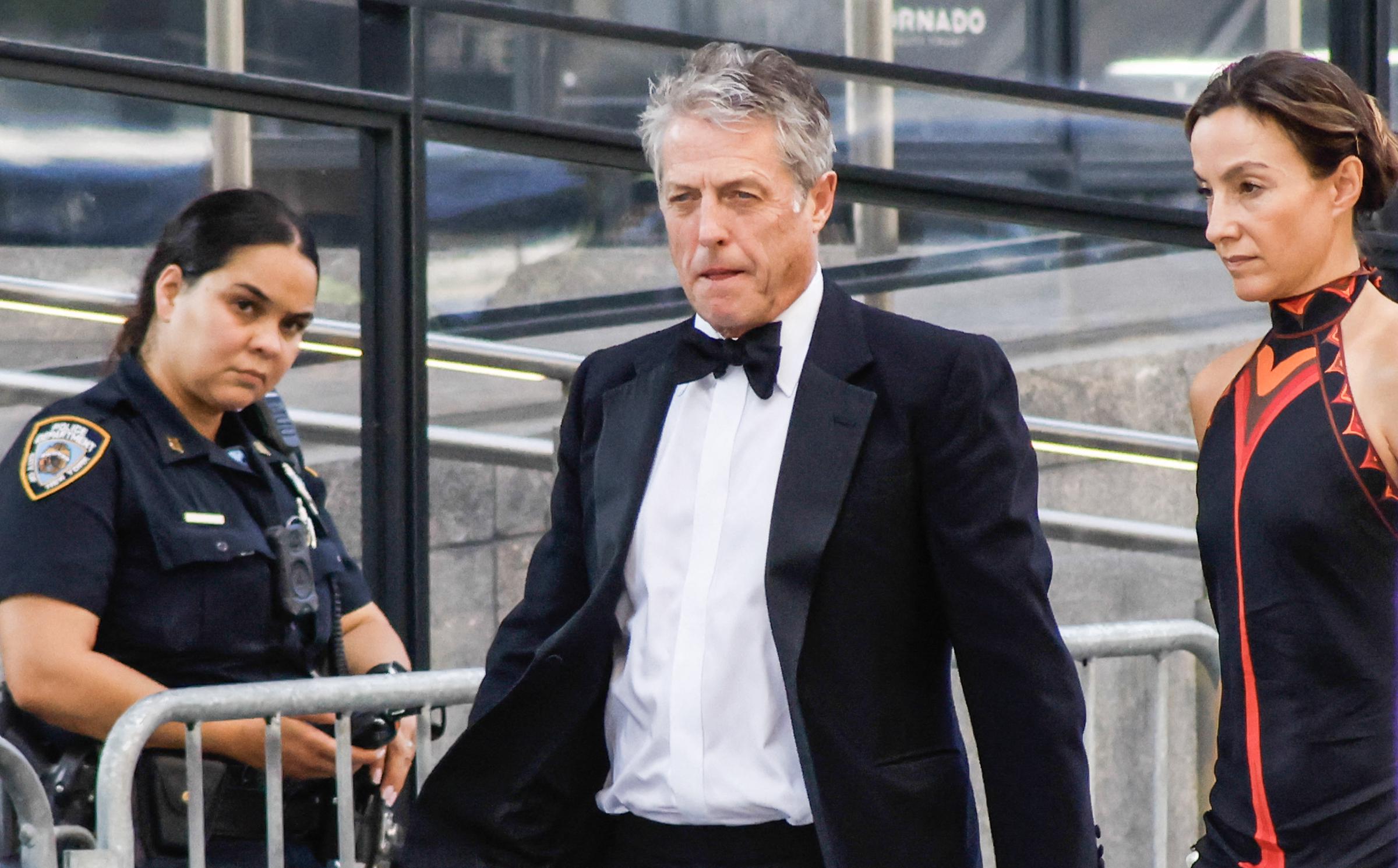 Hugh Grant and Anna Elisabet Eberstein arrive at Madison Square Garden for Taylor Swift and Travis Kelce’s wedding celebration. The couple joined a star-studded guest list for the lavish New York City event. | Source: Getty Images