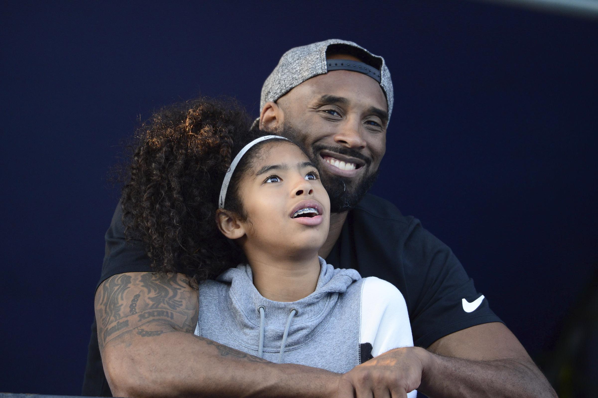 Gianna and Kobe Bryant photographed at the 2018 Phillips 66 U.S. National Swimming Championships on July 26. | Source: Getty Images