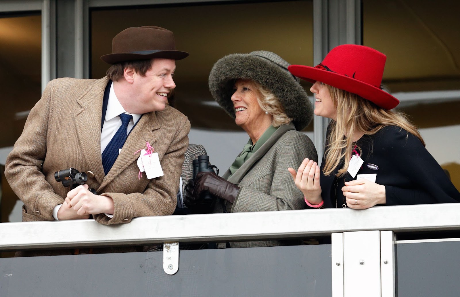 Tom Parker Bowles, Queen Camilla, and Laura Lopes enjoyed day two of the Cheltenham Festival at Cheltenham Racecourse on March 11, 2015, in England. The trio shared a lighthearted moment, reflecting the close-knit bond among Queen Camilla and her children. | Source: Getty Images