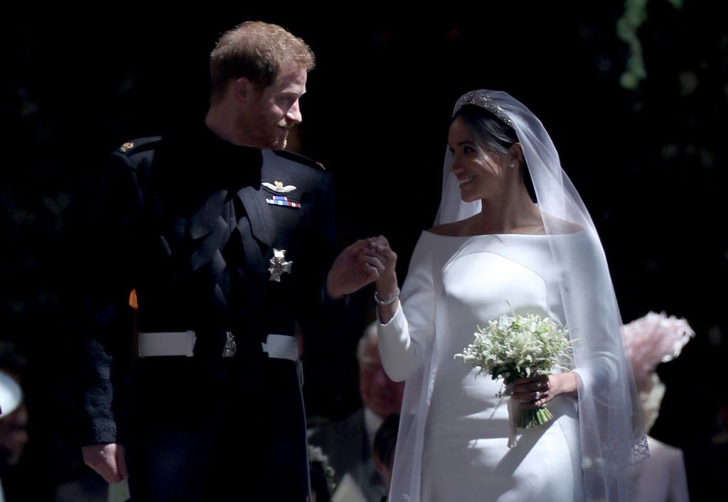 Prinz Harry und Meghan Markle reisen nach ihrer Hochzeitszeremonie in der St.-Georgs-Kapelle auf Schloss Windsor am 19. Mai 2018 in Windsor ab. | Quelle: Getty Images