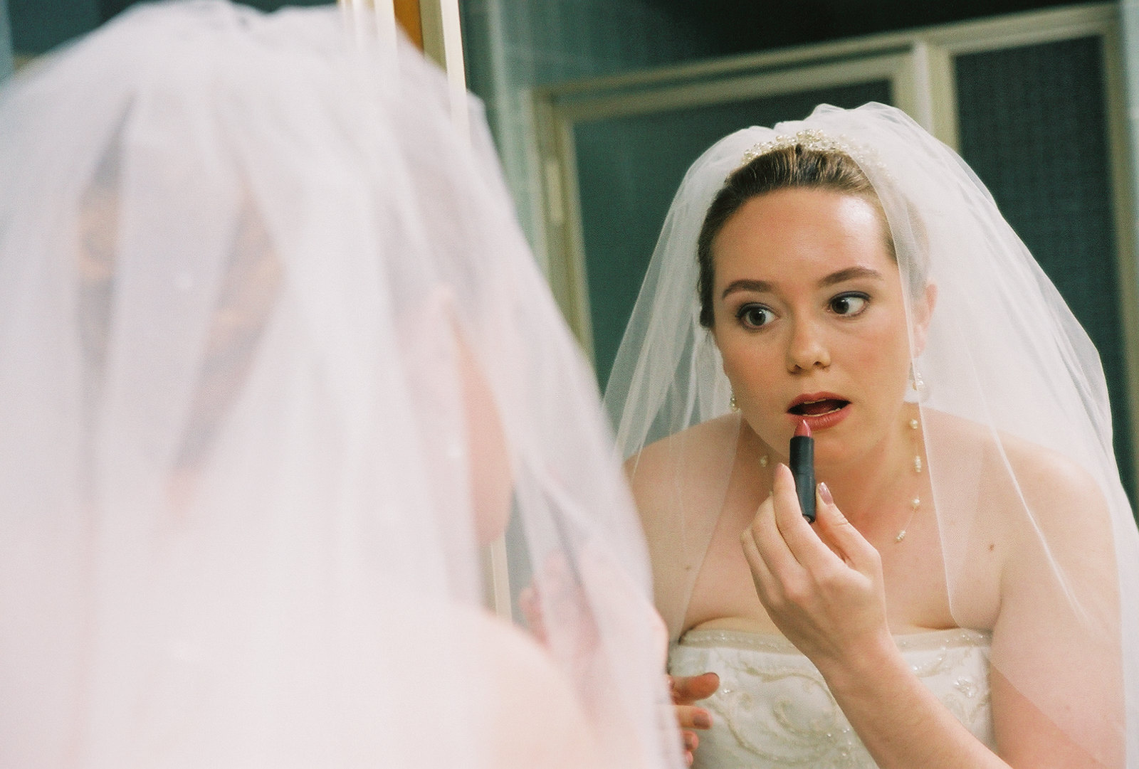 A woman applying lipstick | Source: flickr.com/madprime