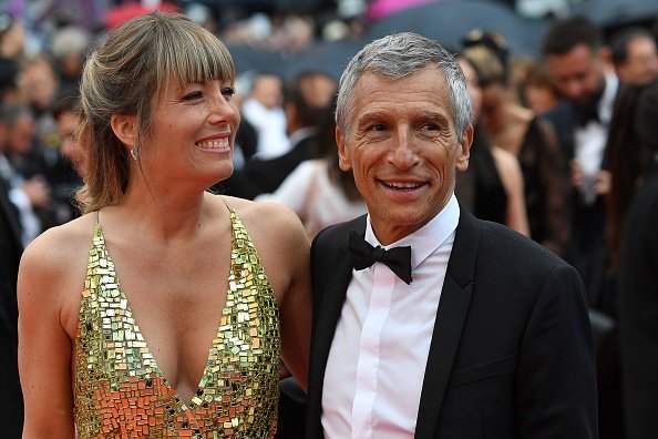 Nagui et son épouse Melanie Page arrivent pour la projection du film "Les Plus Belles Annees D'Une Vie". | Photo : Getty Images