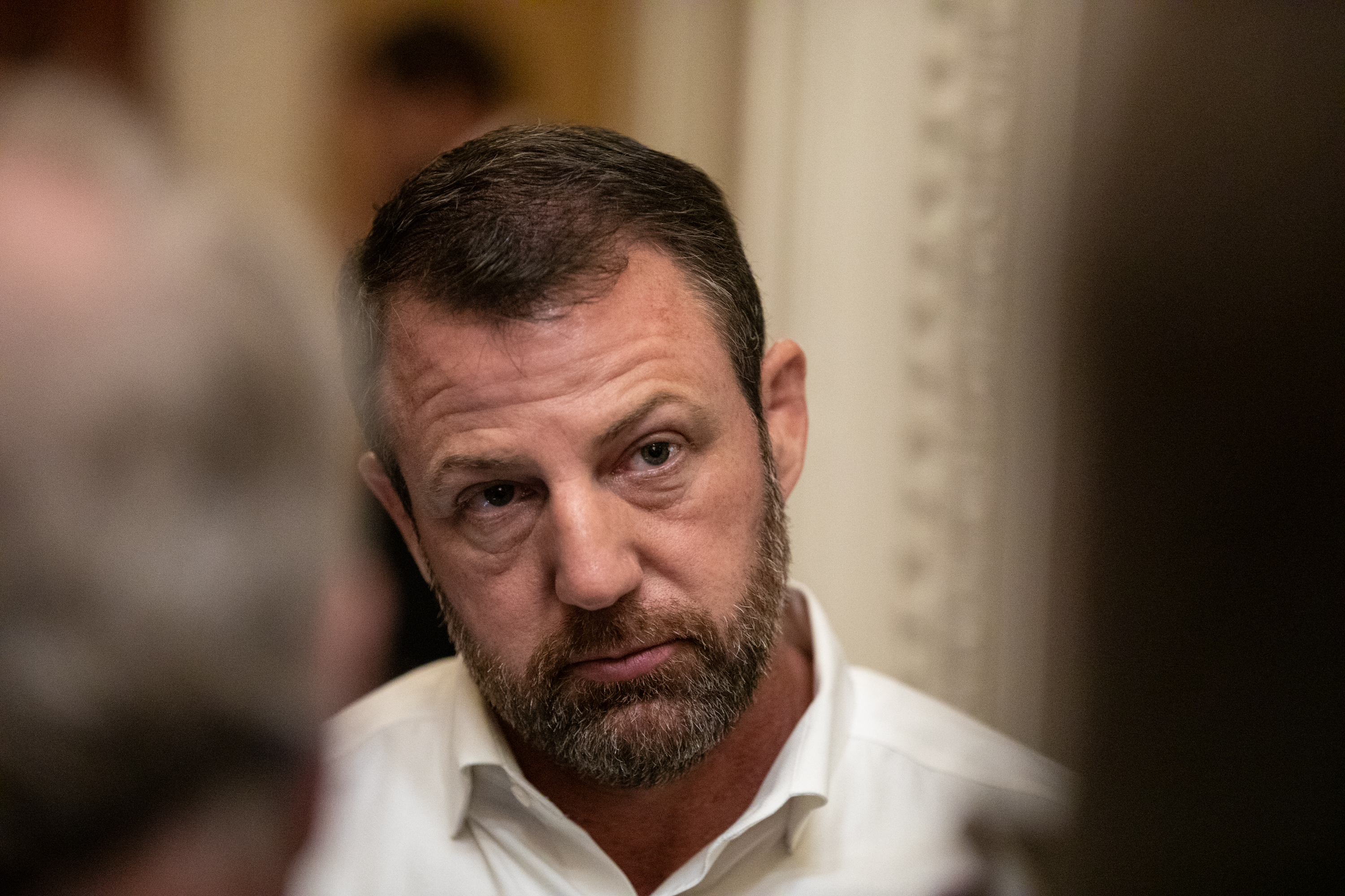 Sen. Markwayne Mullin speaks to reporters following a Republican conference meeting on Capitol Hill on November 9, 2025 in Washington, DC. | Source: Getty Images