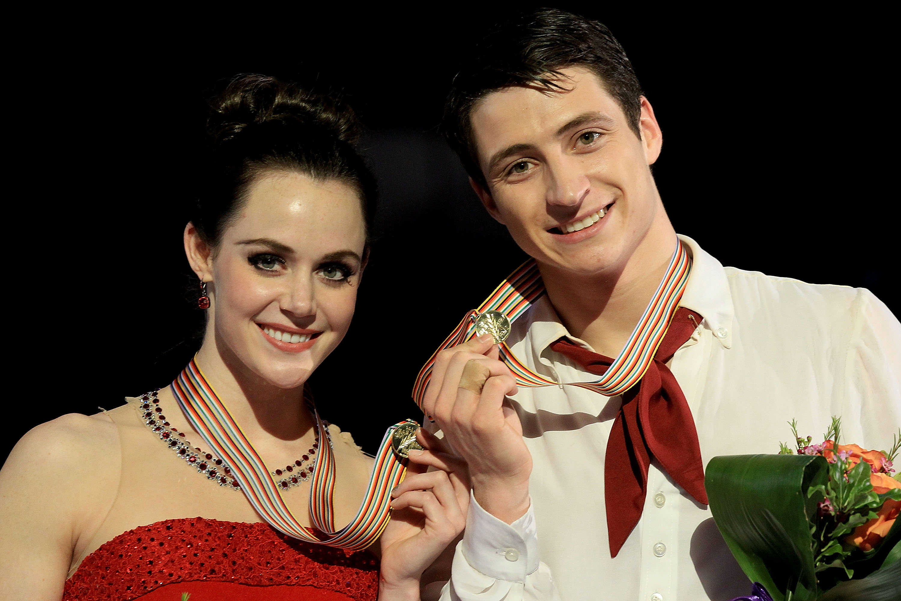 Tessa Virtue and Scott Moir of Canada pose for photographers after winning the Ice Dance Competition during the ISU Four Continents Figure Skating Championships at World Arena on February 12, 2012 in Colorado Springs, Colorado | Source: Getty Images