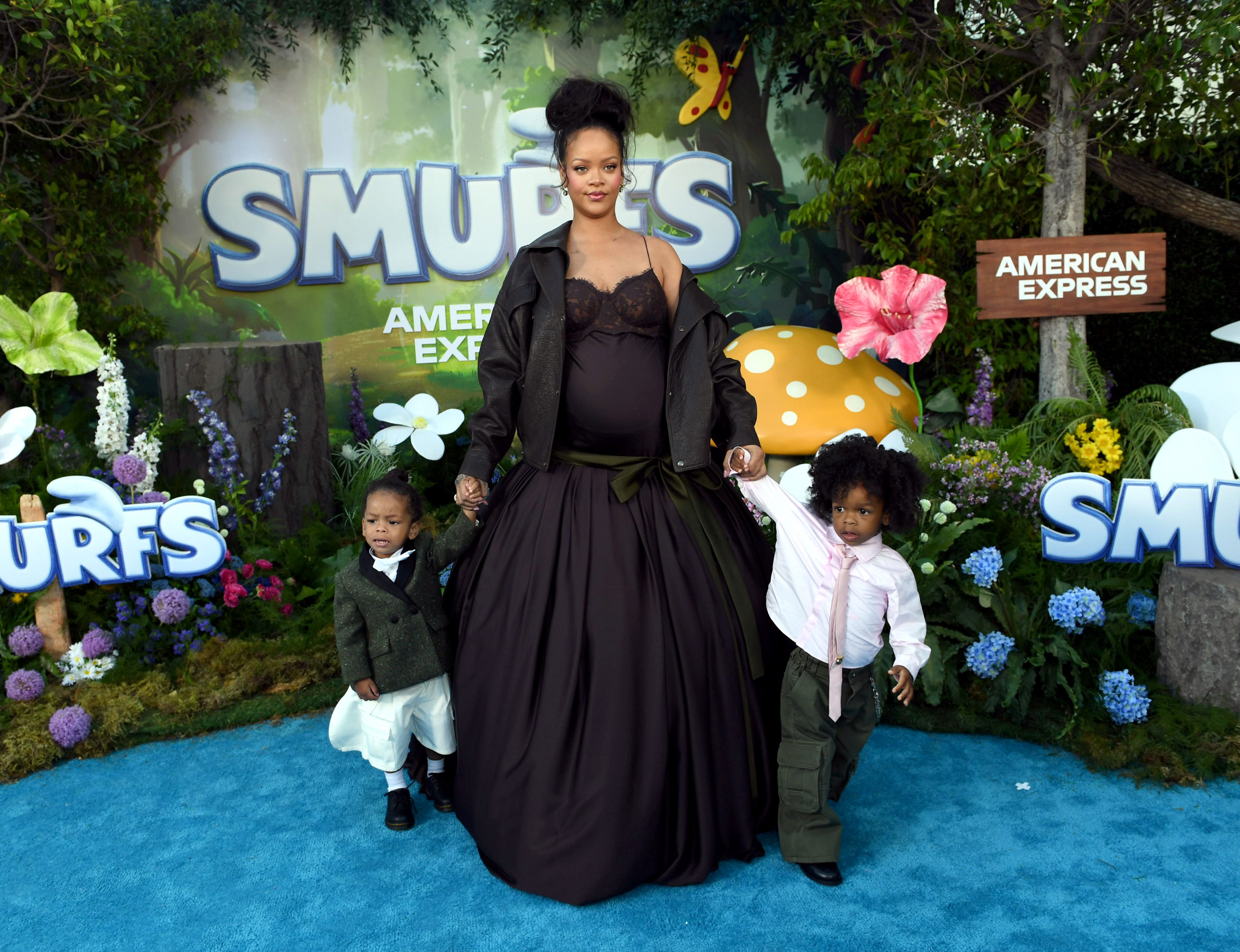 Rihanna holding hands with her sons Riot Rose Mayers and RZA Athelston Mayers | Source: Getty Images