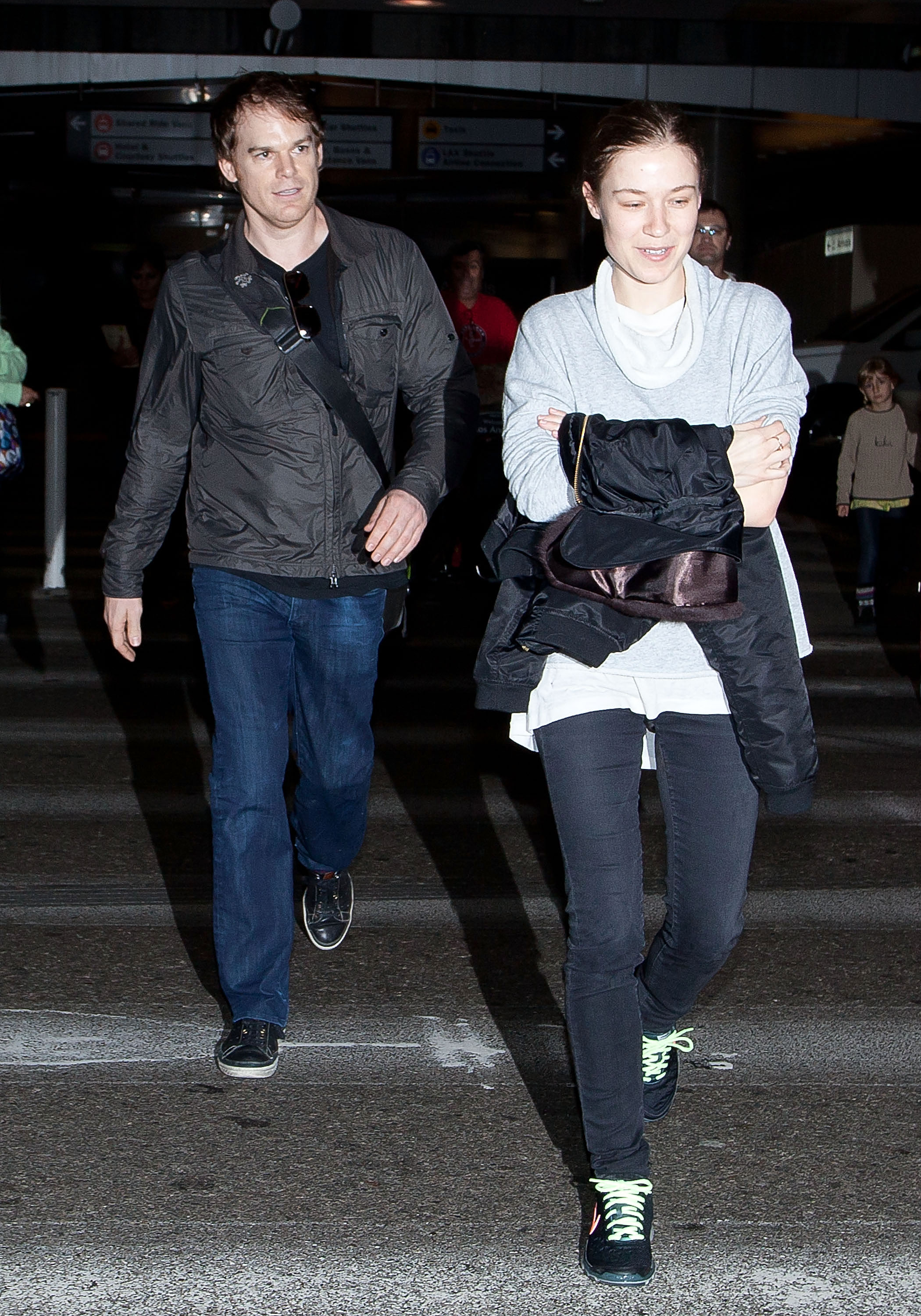 Michael C. Hall and Morgan MacGregor are seen and photgraphed at the Los Angeles International Airport on November 25, 2012 | Source: Getty Images