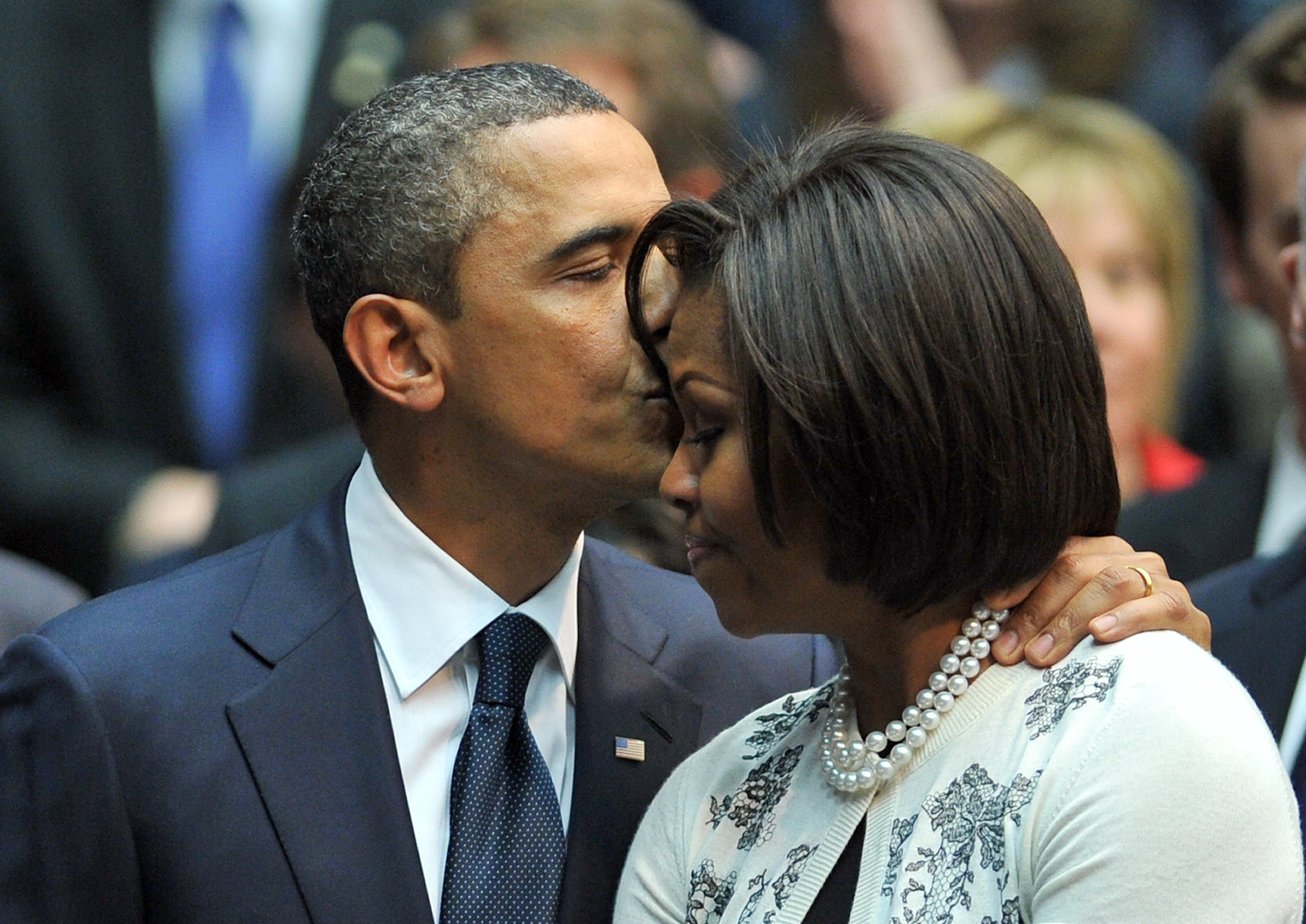 Barack Obama kisses Michelle Obama at the McKale Memorial Center on January 12, 2011 in Tucson, Arizona. | Source: Getty Images
