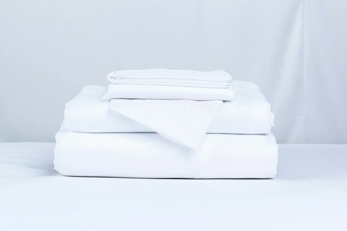 Neatly folded bed linens | Source: Pexels