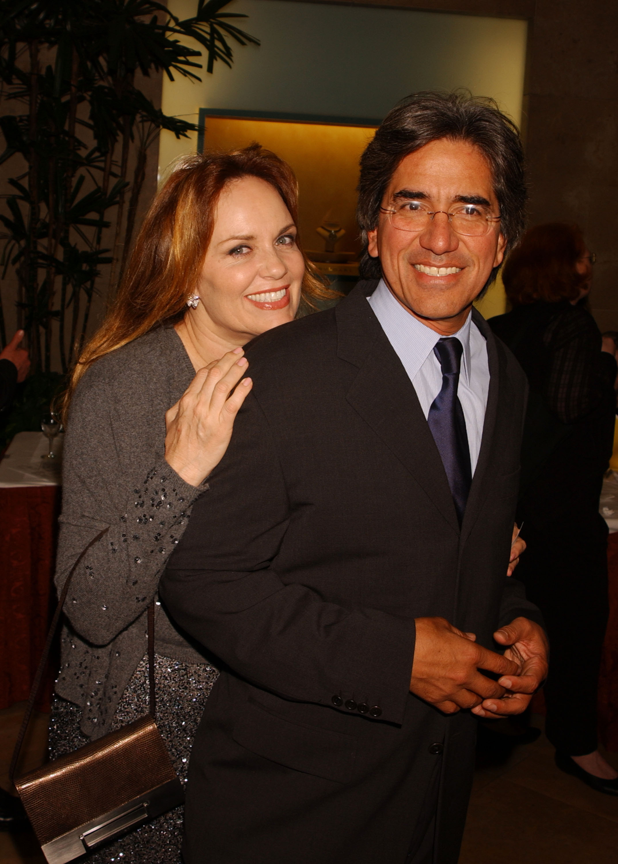 Catherine Bach poses candidly alongside her husband, Peter Lopez, in March 2002. | Source: Getty Images