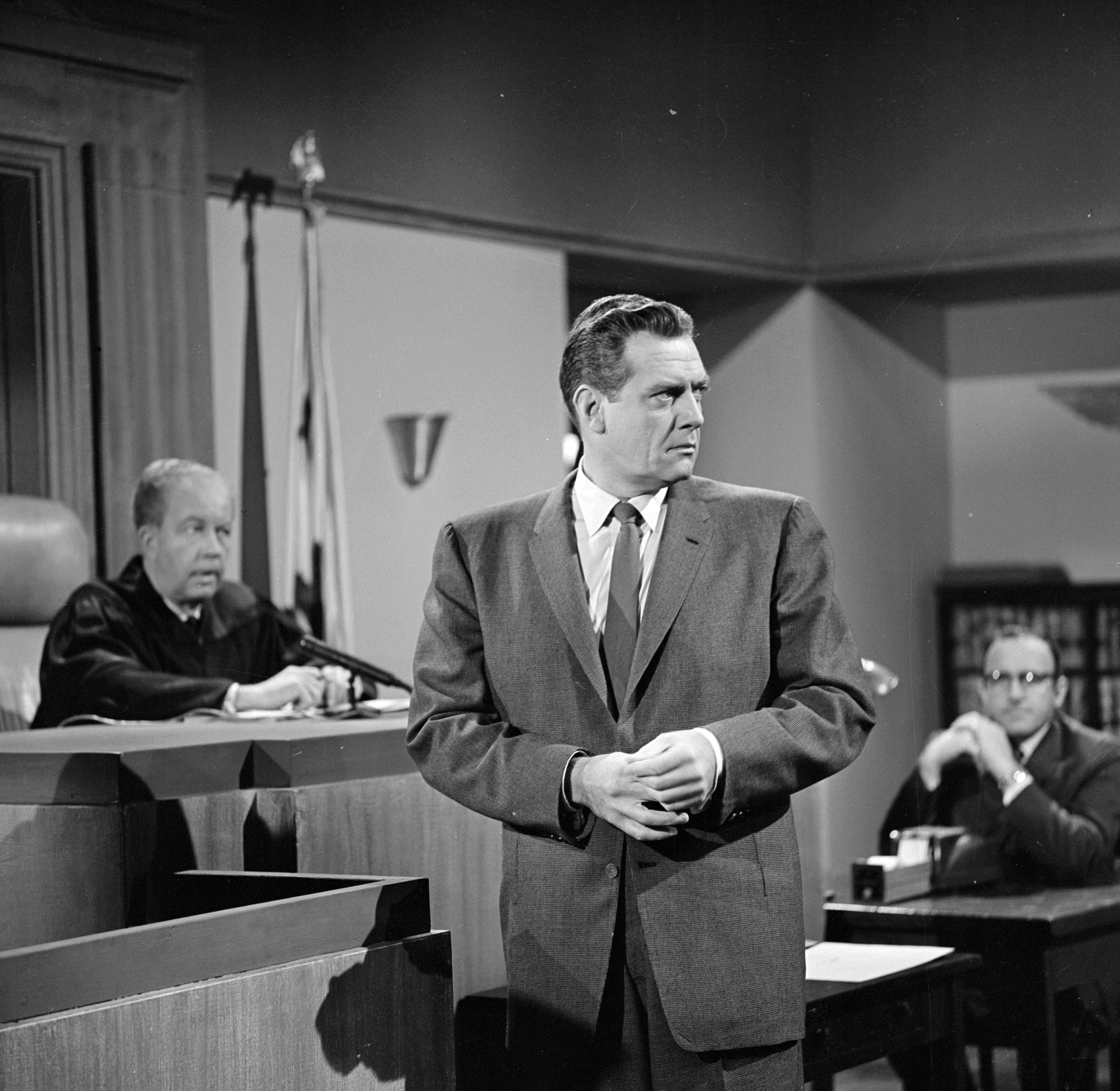 Actors Lewis Martin as Judge Libott and Raymond Burr as Perry Mason perform in a courtroom scene in an episode of the TV series "Perry Mason" on November 13, 1961. | Source: Getty Images