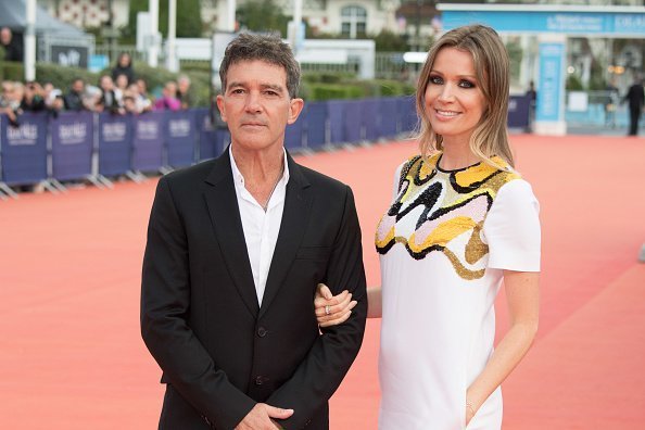 Antonio Banderas and Nicole Kimpel standing on the red carpet of the 43rd Deauville American Film Festival on September 6, 2017. | Source: Getty images