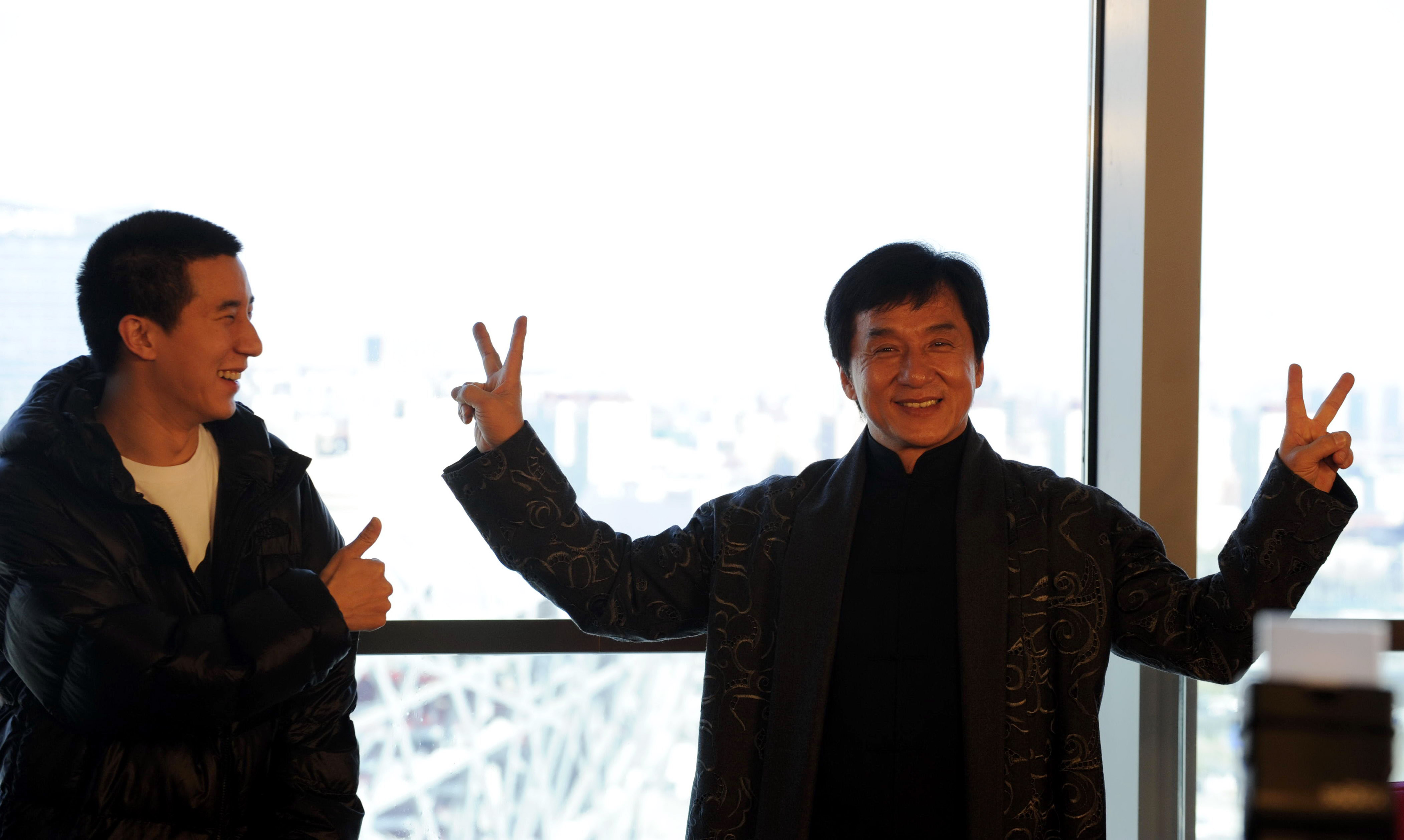Jackie Chan and his son Jaycee Chan attend a press conference announcing a concert at the Bird's Nest Stadium on April 1, 2009 in Beijing, China. | Source: Getty Images