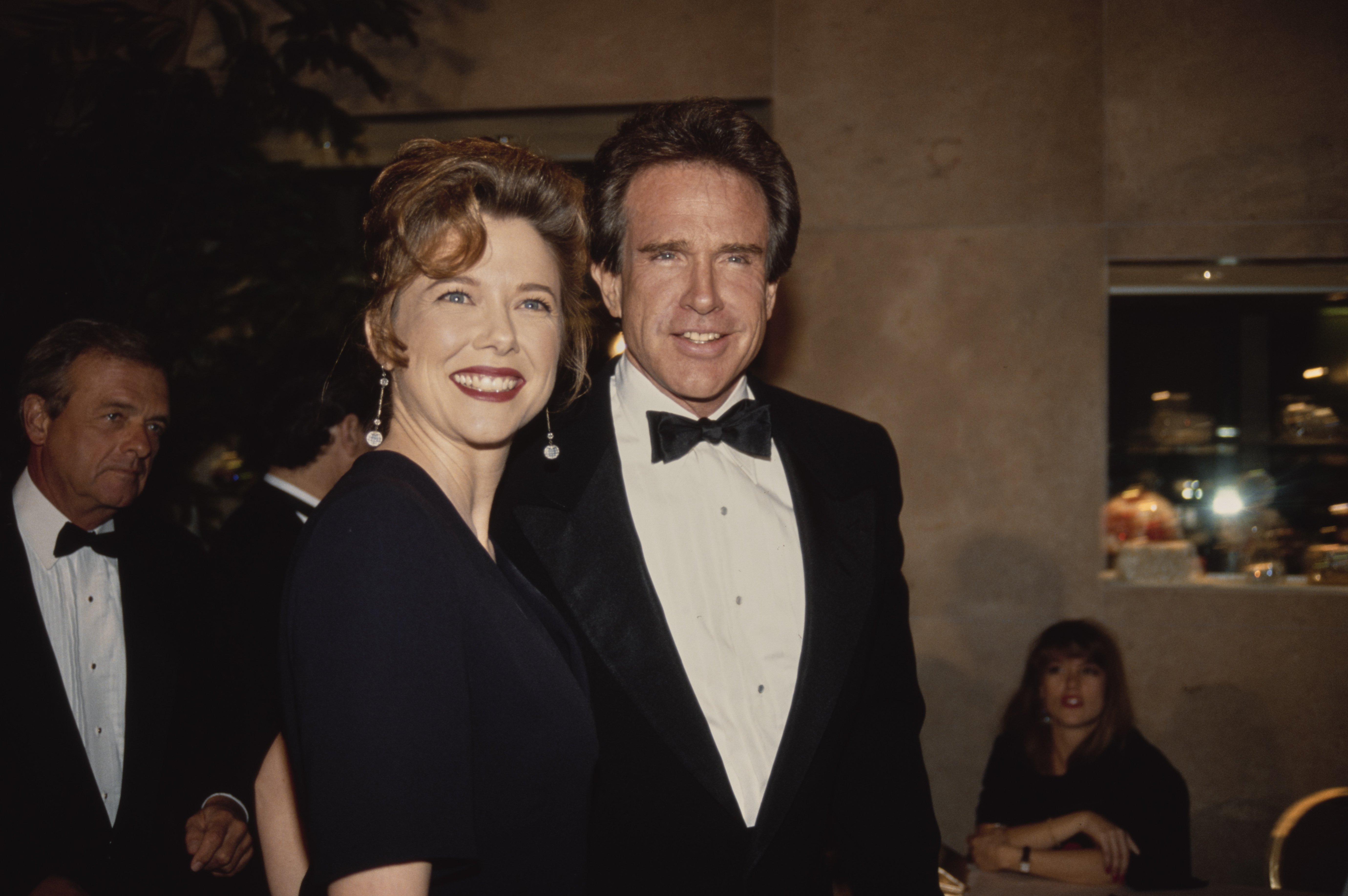  Annette Bening and her husband, American actor Warren Beatty, attend the 44th Annual Directors Guild of America Awards after party, held at Trader Vic's, Beverly Hilton Hotel in Beverly Hills, California, 14th March 1992 | Source: Getty Images 