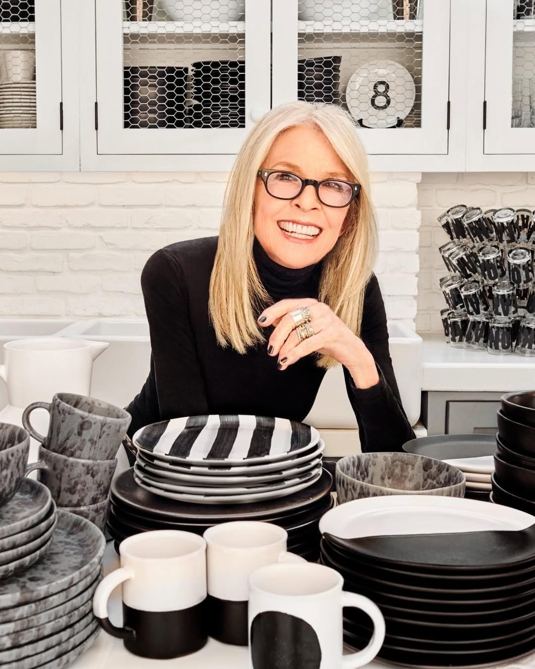 Diane Keaton pictured with her black-and-white dishware collection inside her Sullivan Canyon home, dated August 15, 2024 | Source: Instagram/hudsongracesf