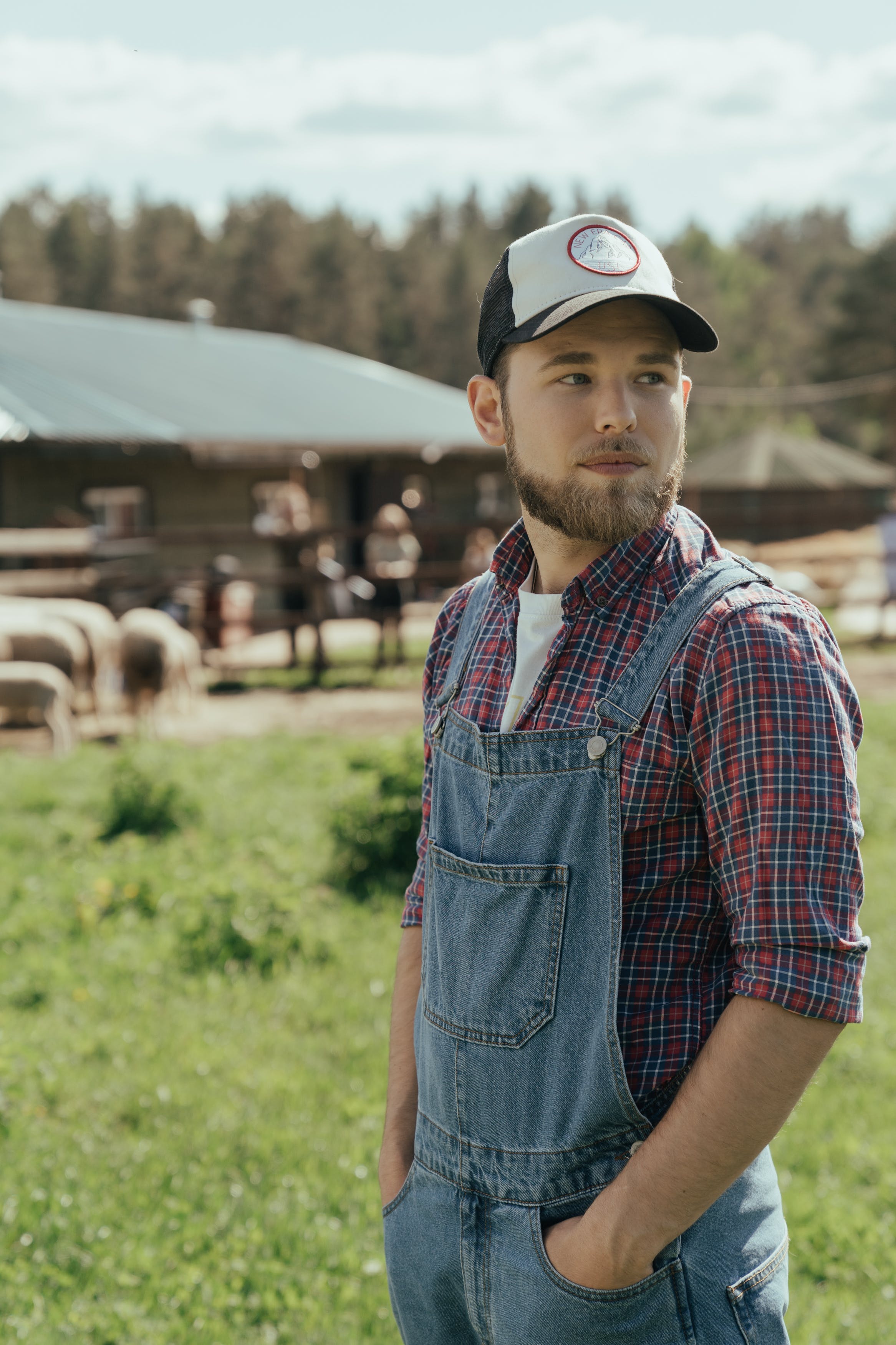 A young farmer dressed in work clothes | Source: Pexels