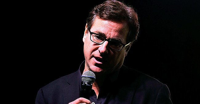Bob Saget speaks on stage during an event. | Source: Getty Images