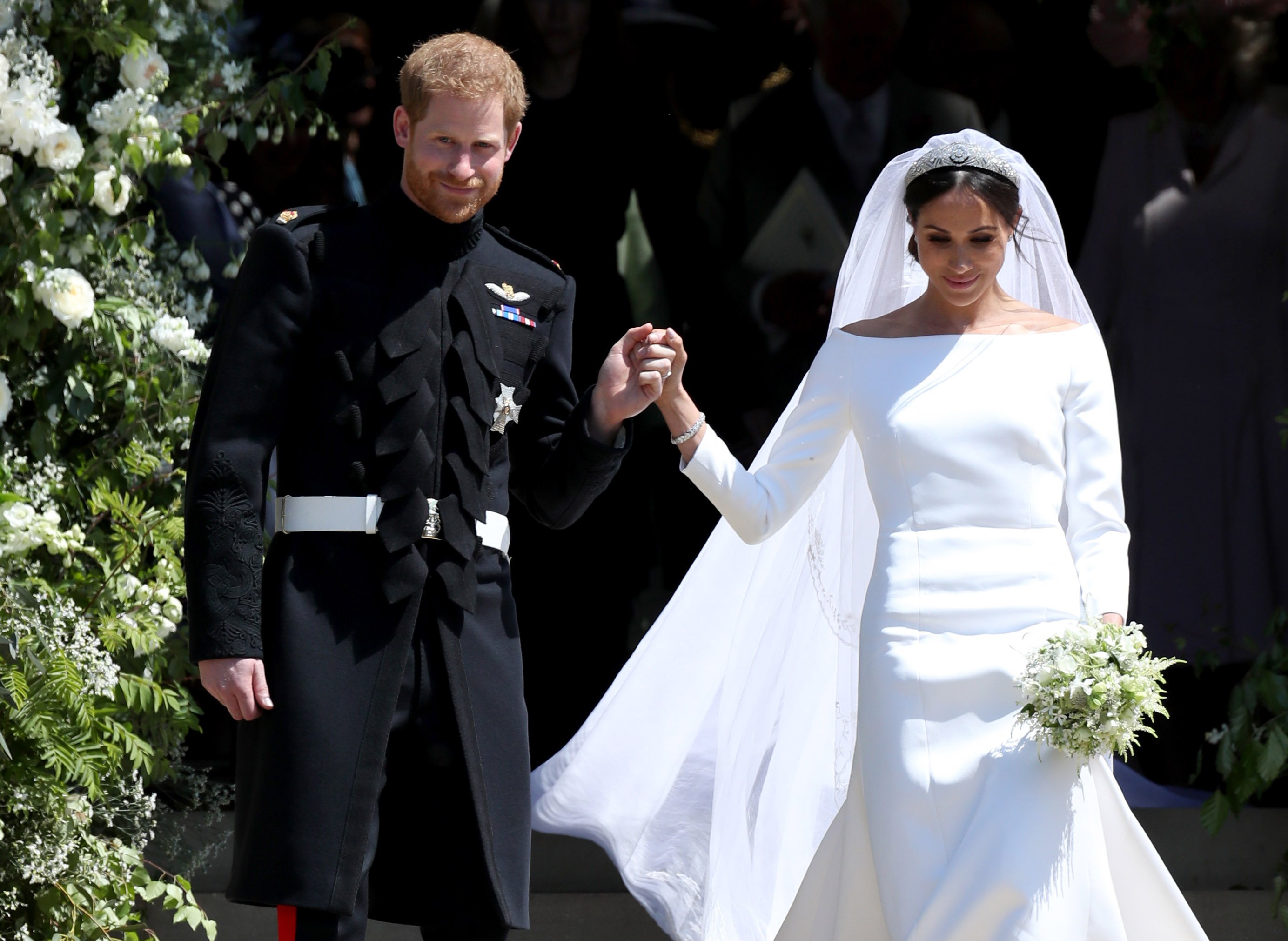 Prens Harry ve Meghan Markle, 19 Mayıs 2018'de Windsor, İngiltere'deki Windsor Şatosu'ndaki St George Şapeli'ndeki düğün törenlerinin ardından ayrılıyor |  Kaynak: Getty Images