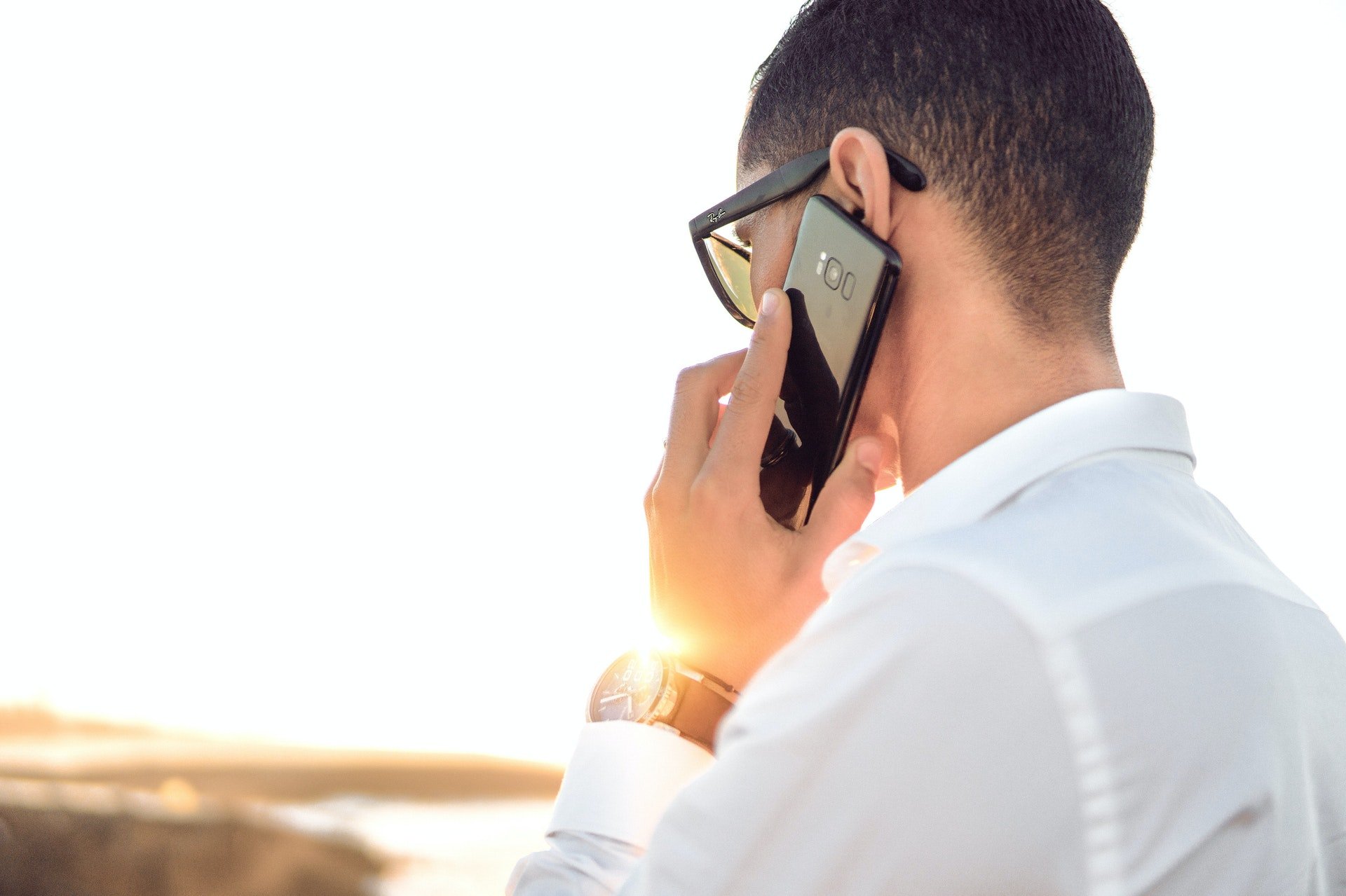 Man on the phone | Photo: Pexels/Hassan OUAJBIR