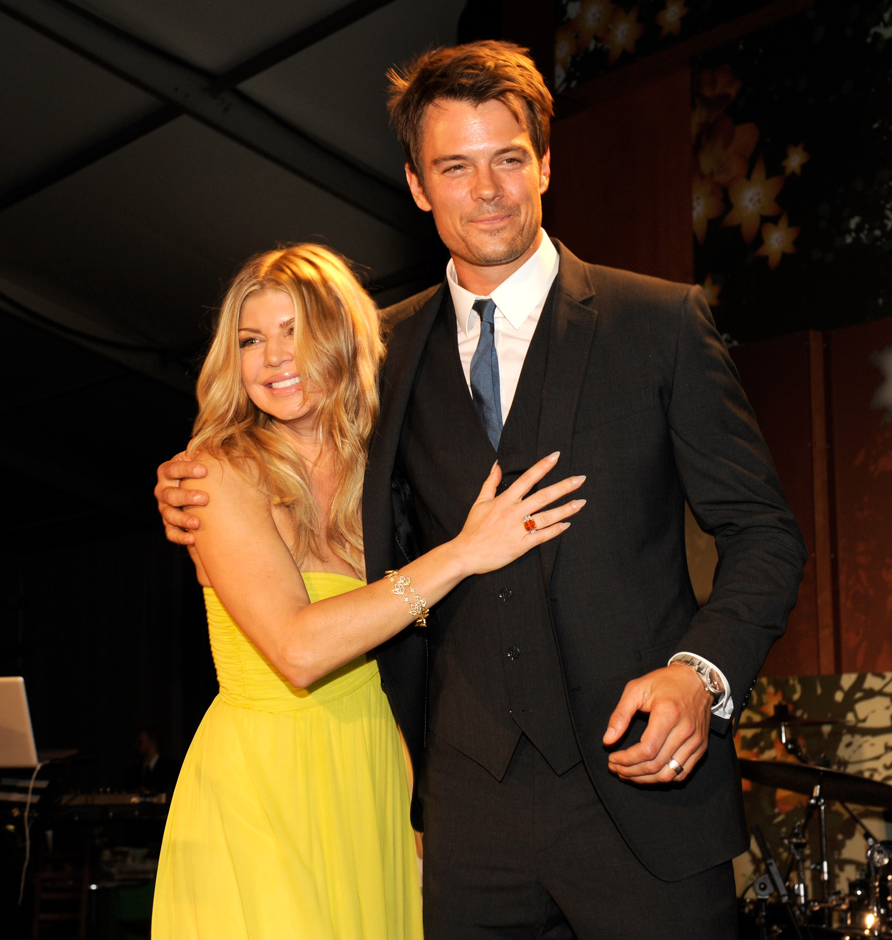 Fergie and Josh Duhamel on stage at the 2011 FiFi Awards at The Tent at Lincoln Center on May 25, 2011 in New York City | Source: Getty Images