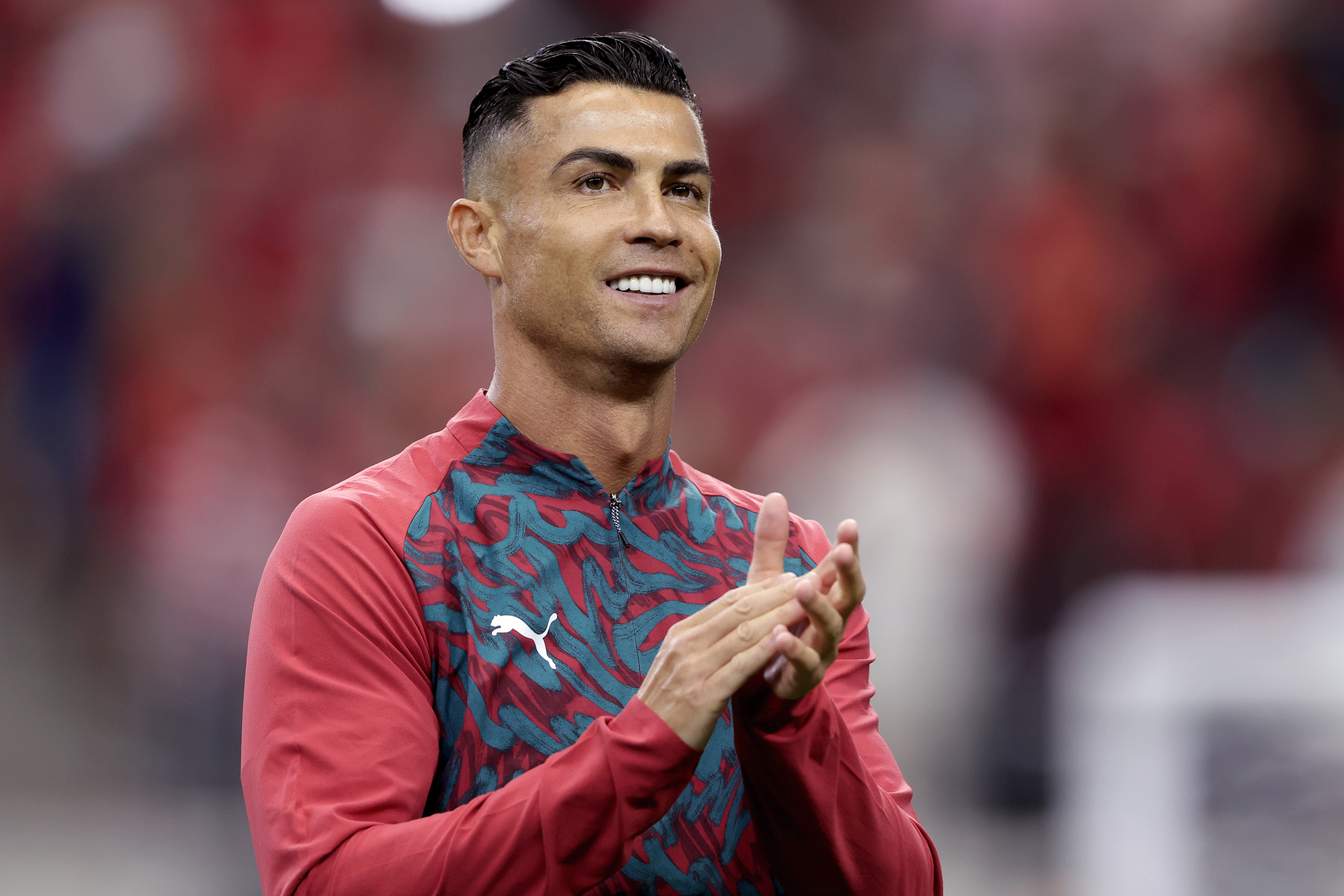 Cristiano Ronaldo warmed up before Portugal's 2026 FIFA World Cup Round of 16 match against Spain at Dallas Stadium on July 6 in Arlington, Texas. More than two decades after emerging as a teenage sensation, the veteran forward showcased the polished appearance that has fueled years of discussion about his evolving look, with his bright smile, defined jawline, and remarkably smooth complexion drawing fresh attention online.