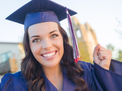 A young woman celebrating her graduation. | Source: Shutterstock