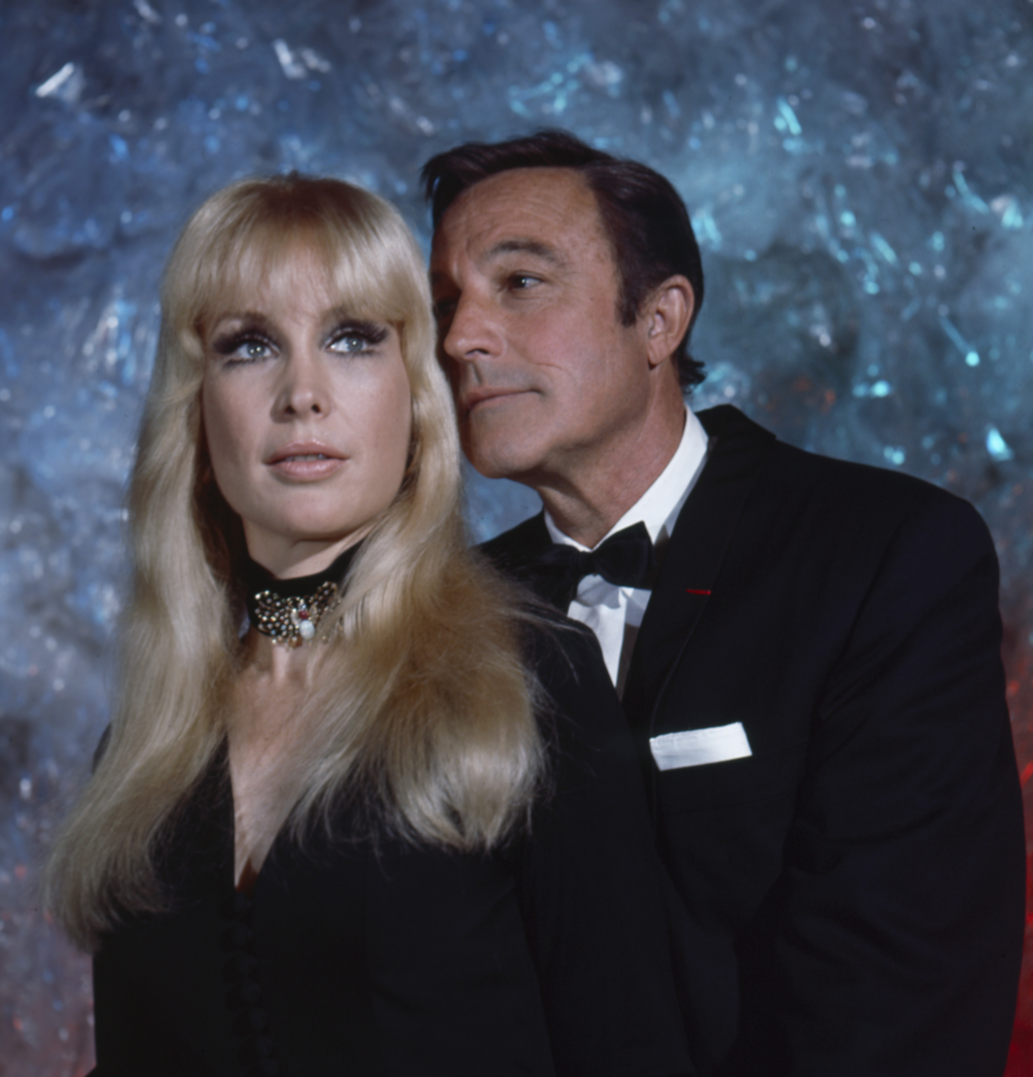 Barbara Eden stands beside Gene Kelly in an elegant promotional shot, wearing a dark outfit and long blond hair. The image publicized the ABC TV special "Changing Scene."